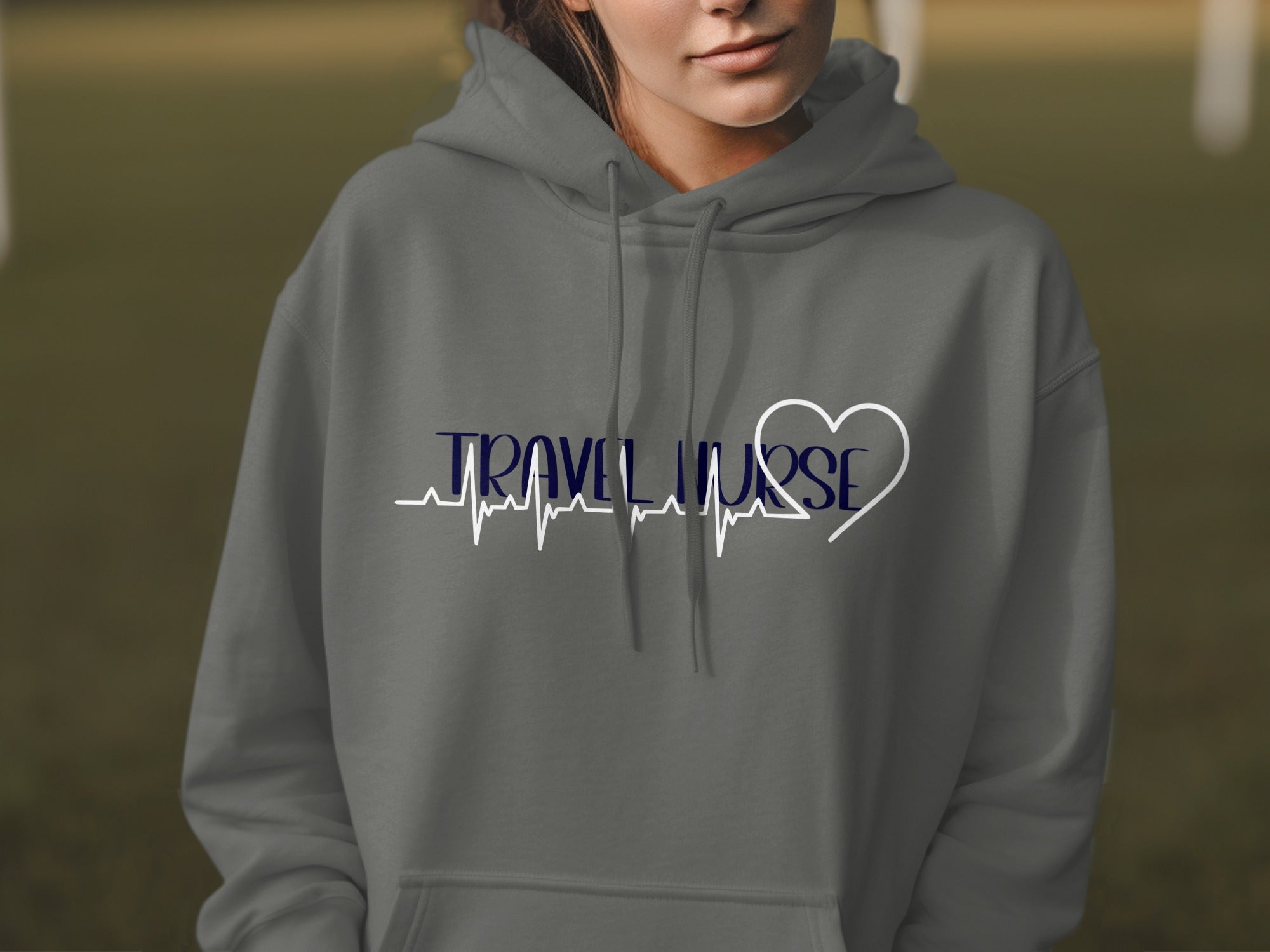 Grey hoodie with "TRAVEL NURSE" text and a heart-shaped ECG line.