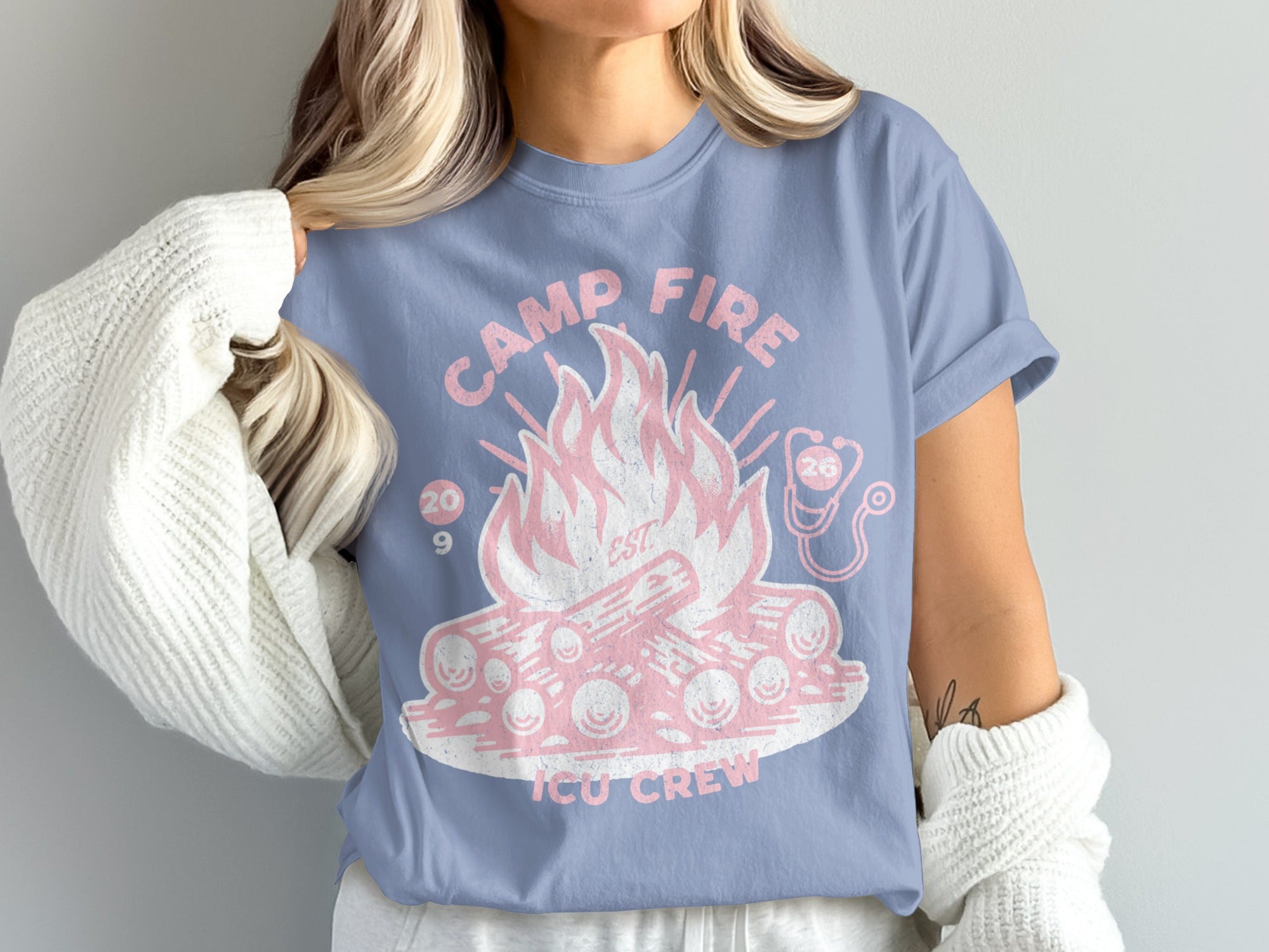 Blue t-shirt with campfire, ICU crew text, stethoscope, and 2019.