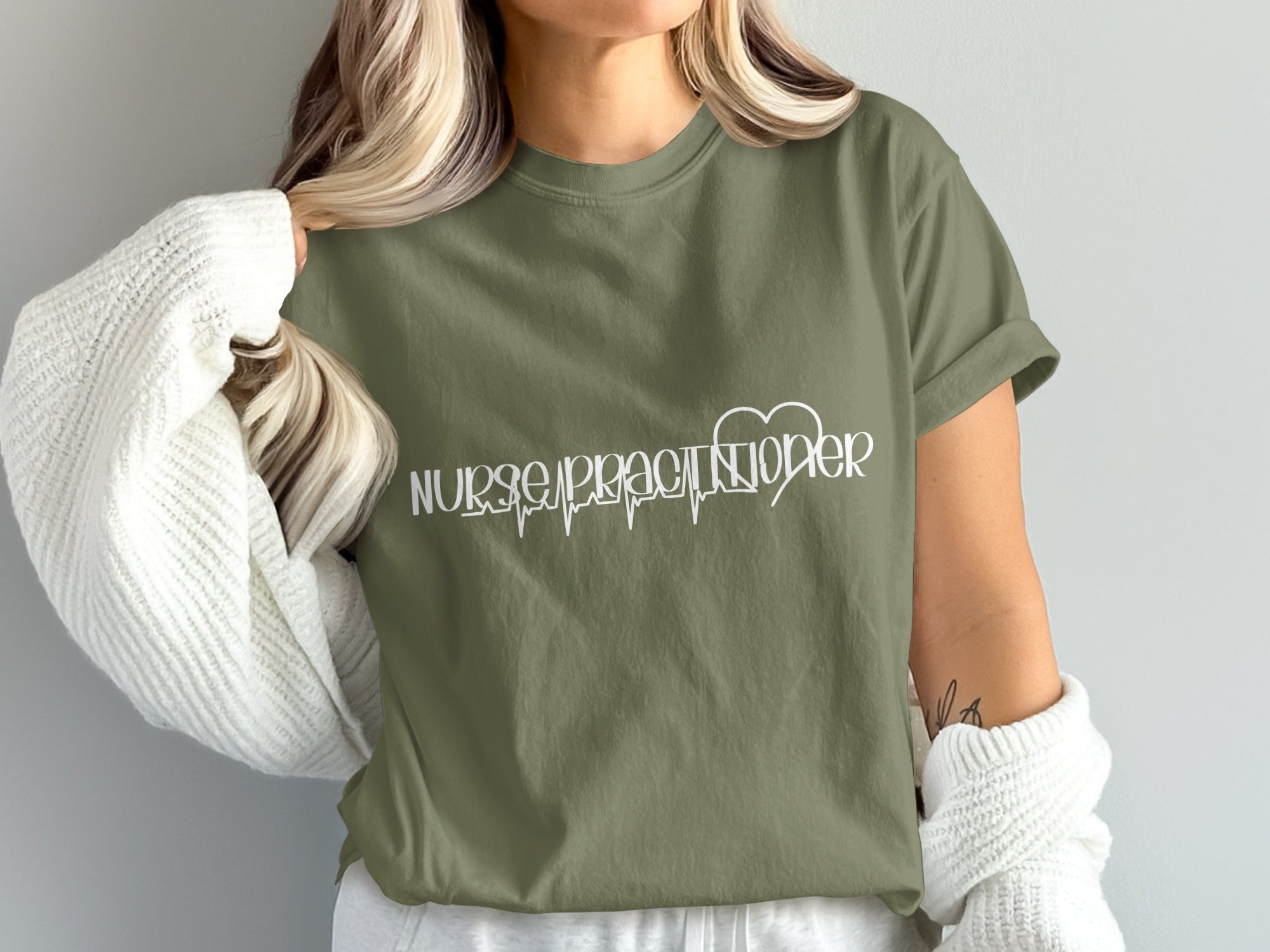 Olive green t-shirt with "Nurse Practitioner" and heart rhythm graphic.