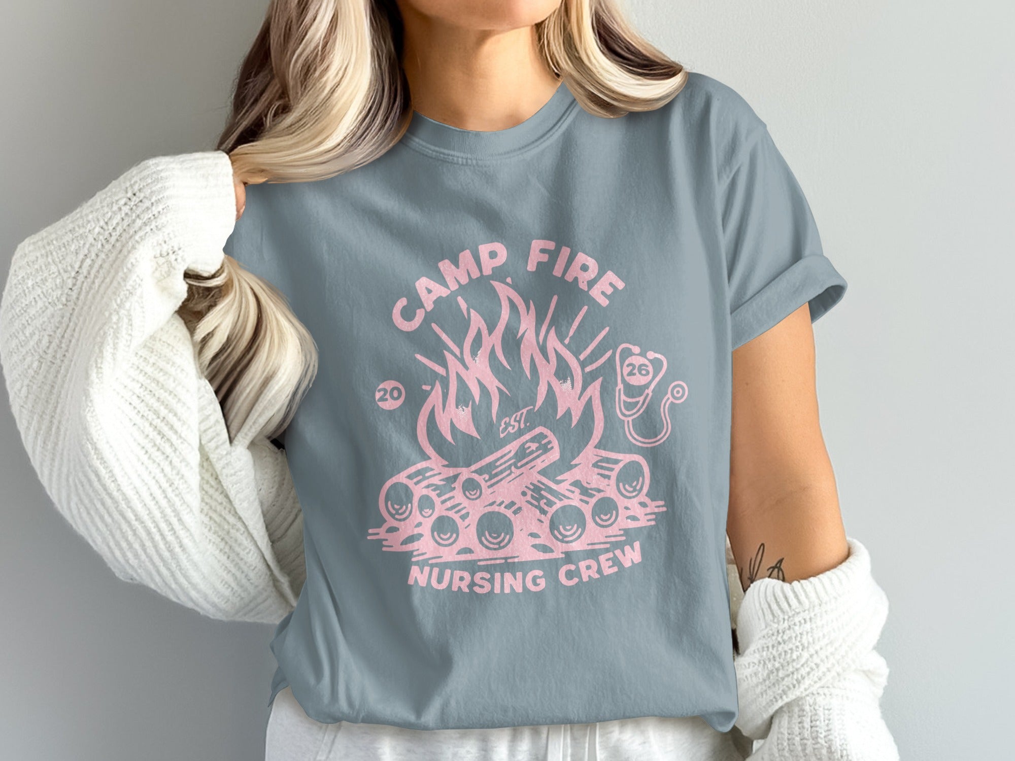Camp Fire Nursing Crew t-shirt with pink campfire and stethoscope graphic.