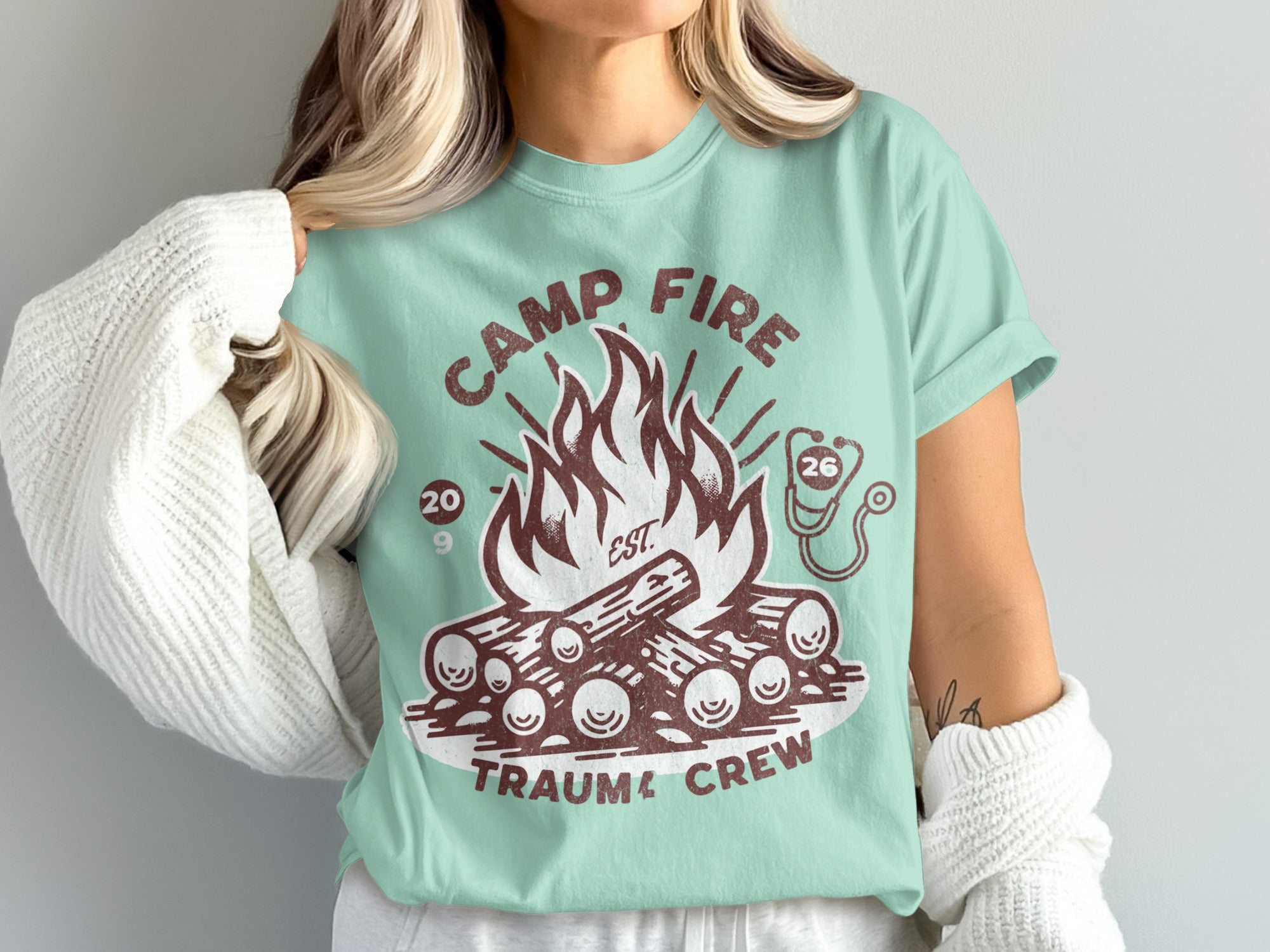 Camp Fire Trauma Crew with campfire and stethoscope graphic.