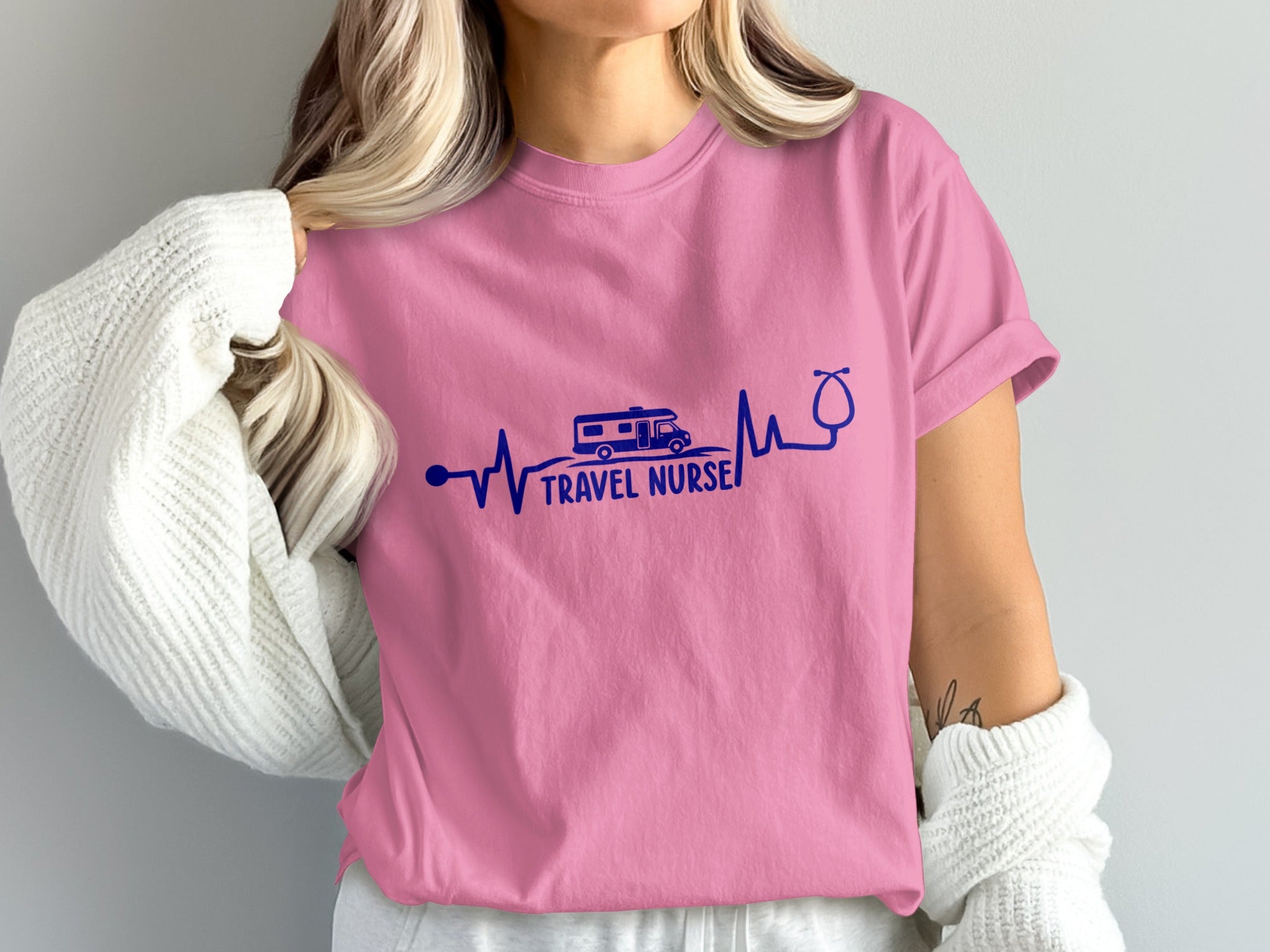Pink t-shirt with "Travel Nurse" text, RV, and stethoscope heartbeat graphic.