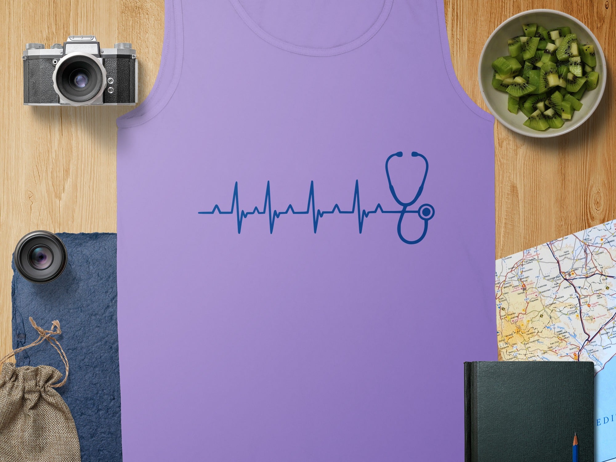 Purple tank top with blue stethoscope heartbeat graphic.