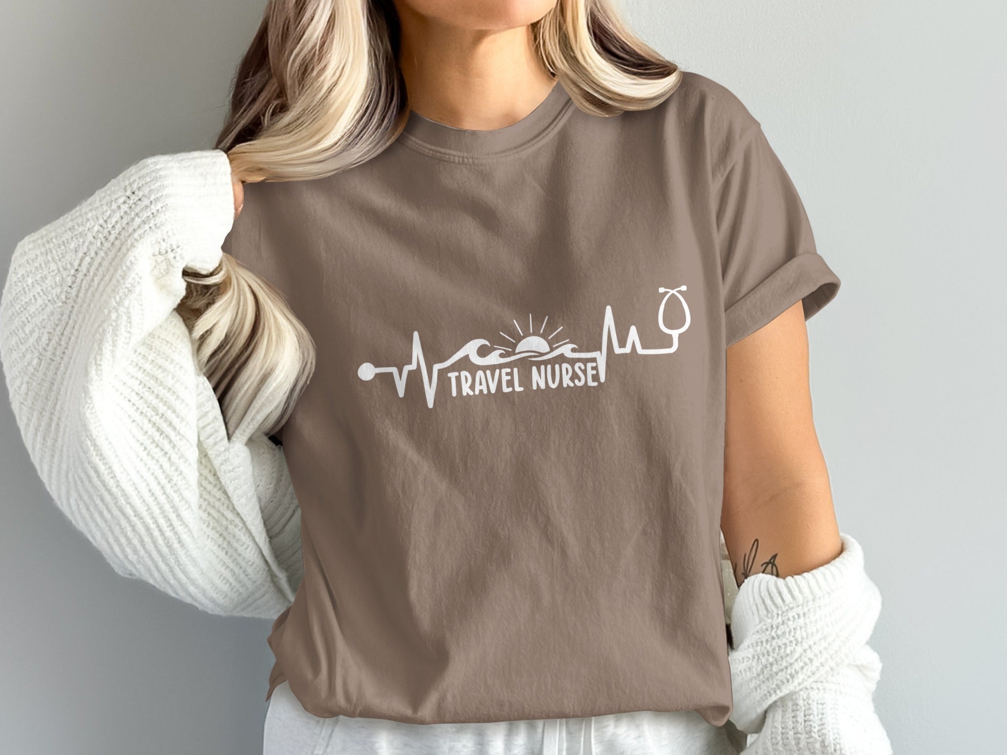 Brown t-shirt with "TRAVEL NURSE" text and a waveform stethoscope design.