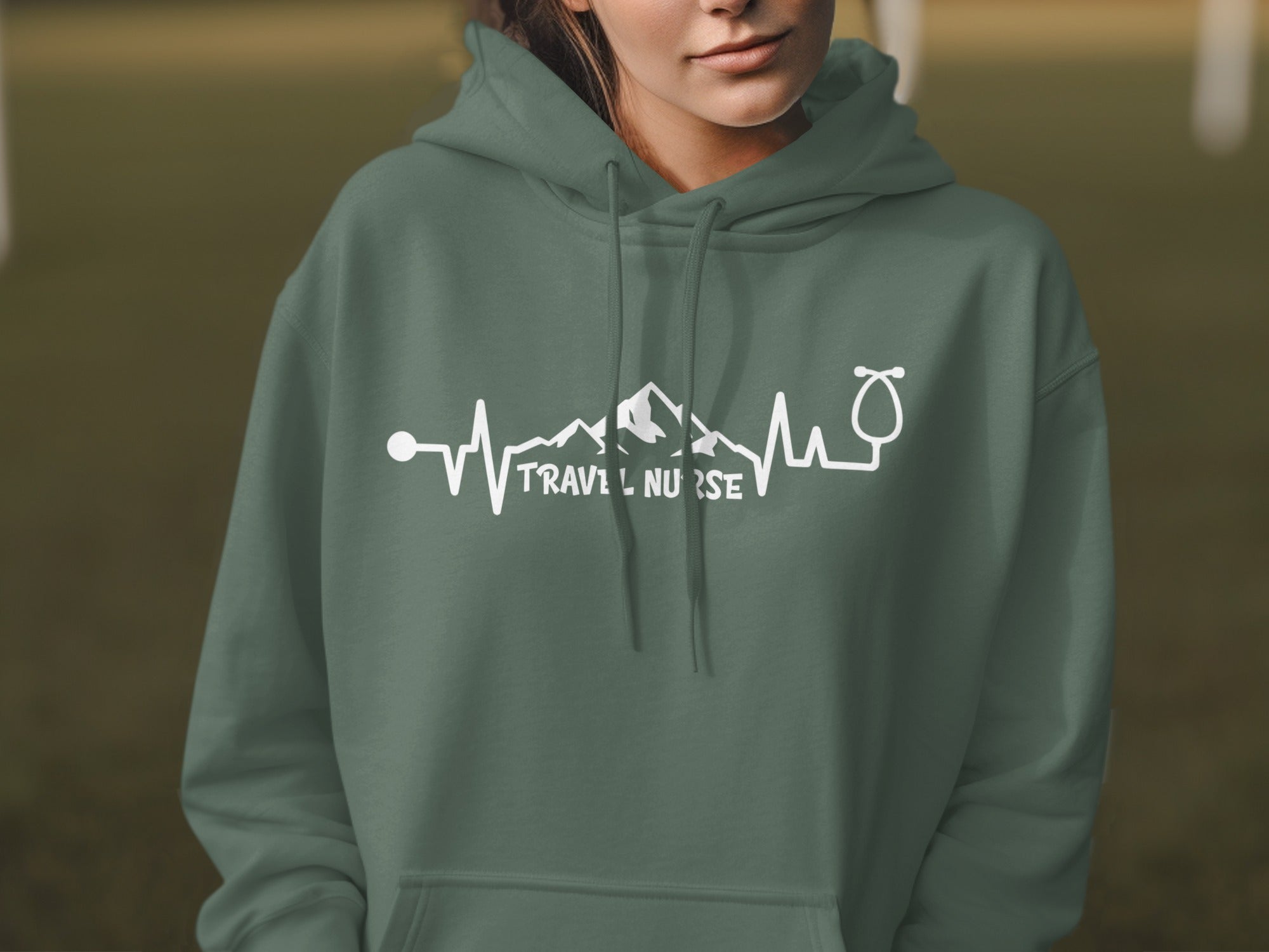 Green hoodie with "Travel Nurse" and heart monitor graphic.