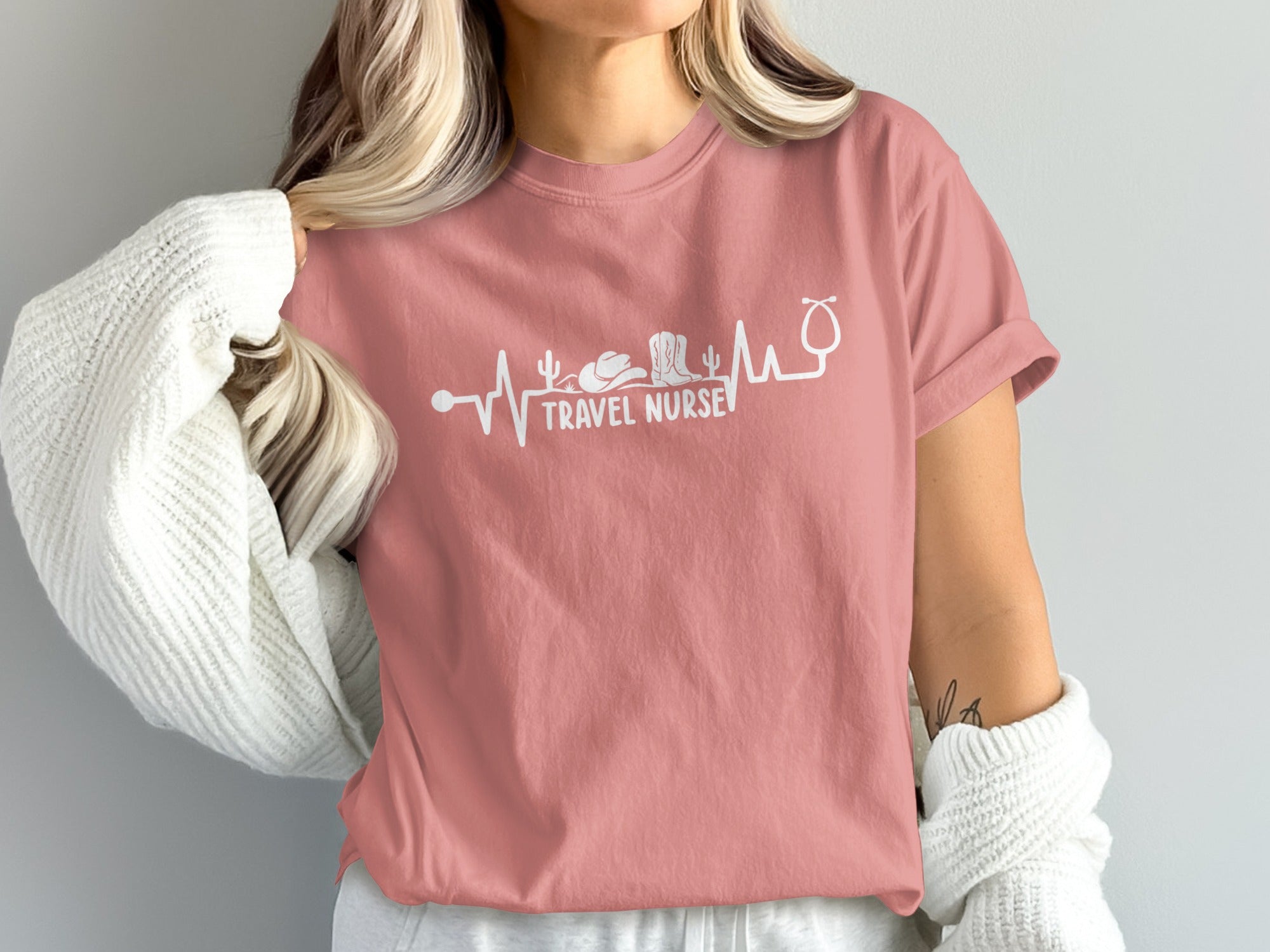 T-shirt with "Travel Nurse" text and heartbeat design including a stethoscope.