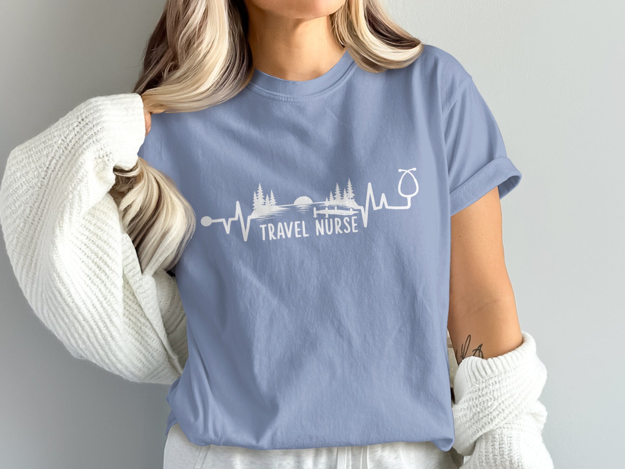 Light blue t-shirt with "Travel Nurse" text and a heartbeat EKG graphic.