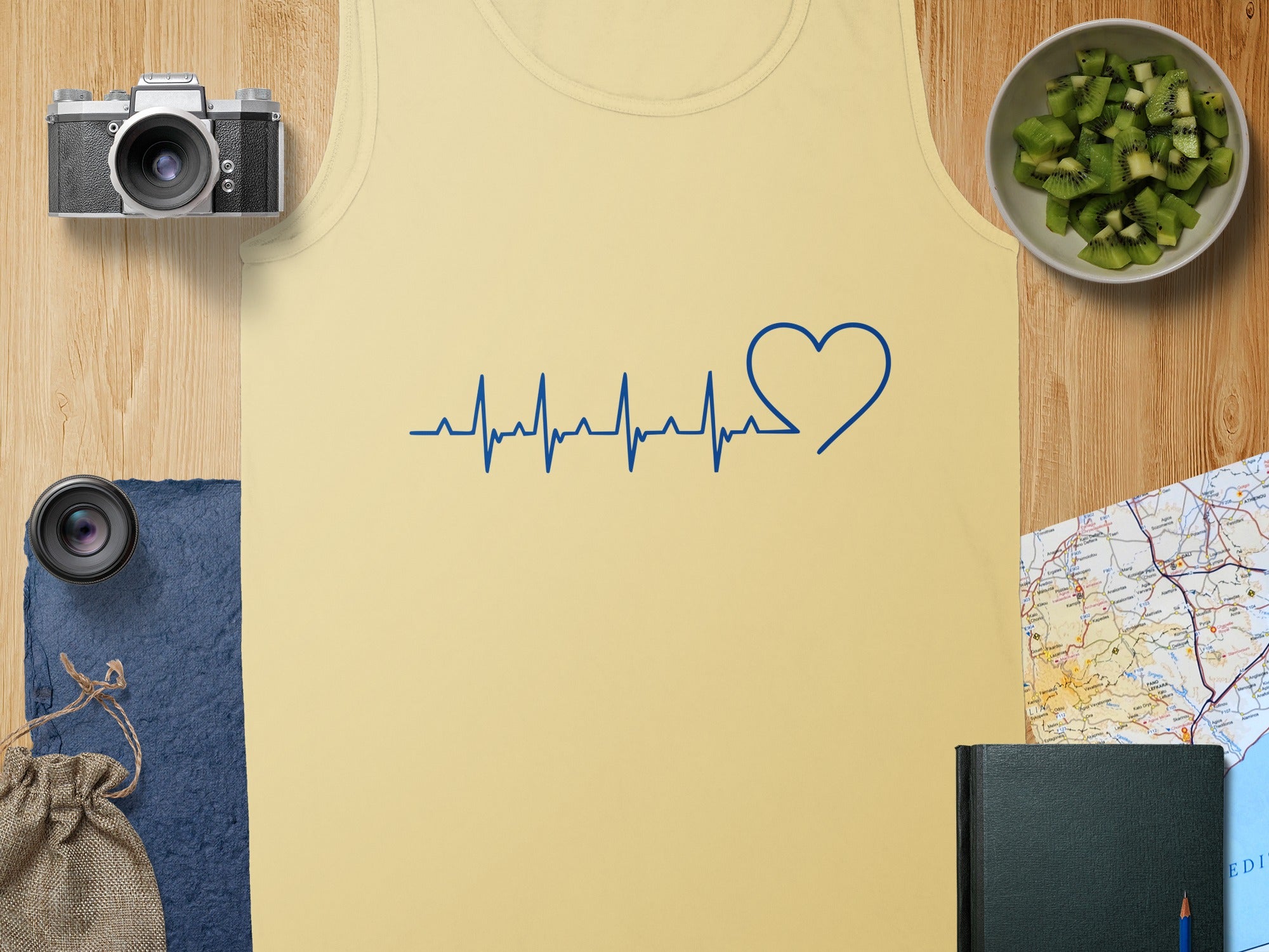 Yellow tank top with blue heart and heartbeat graphic.