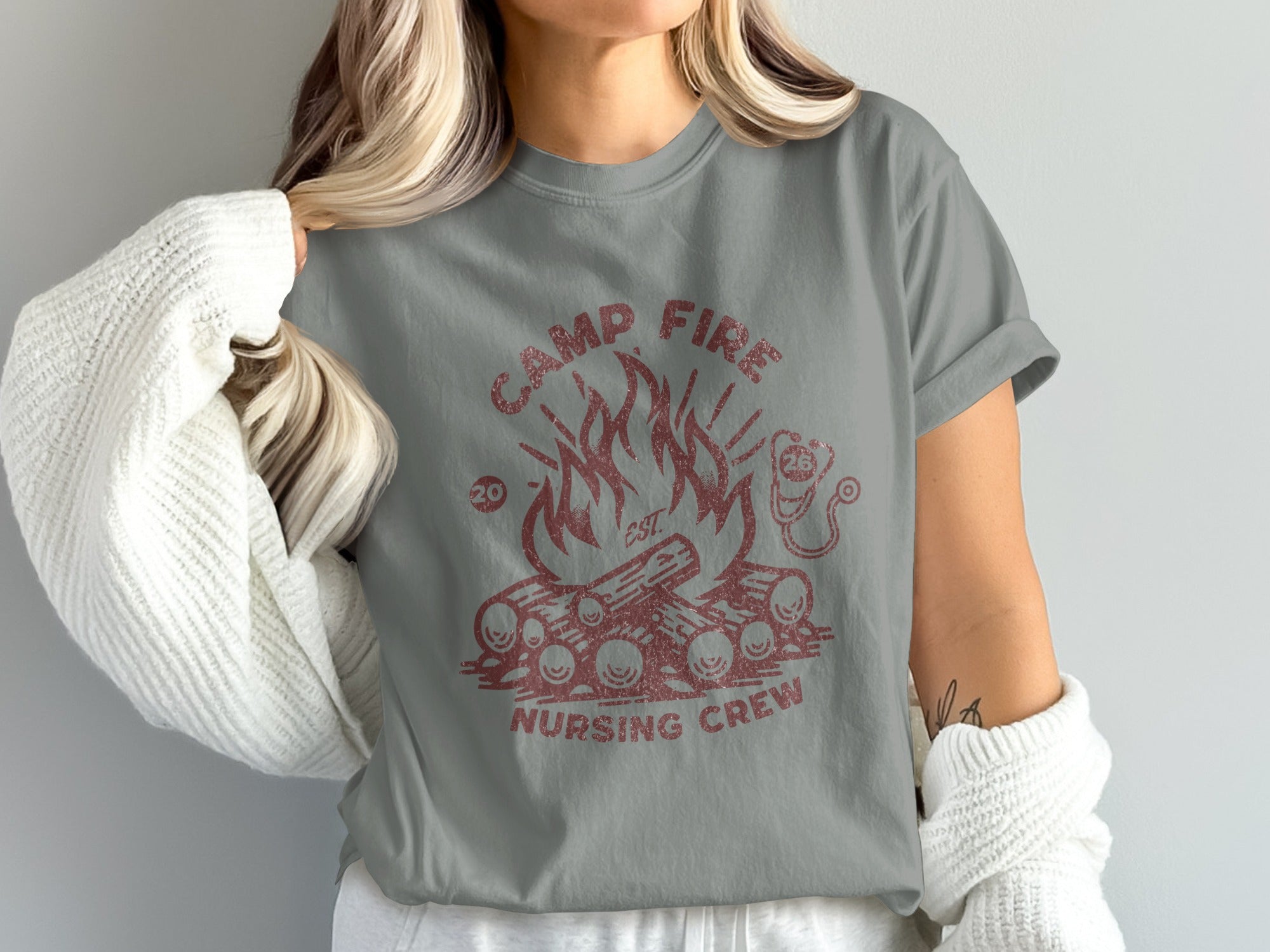 Gray t-shirt with red campfire and "Camp Fire Nursing Crew" text.