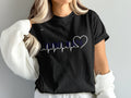 Black t-shirt with "TENNESSEE LOVE" text and a heartbeat graphic.
