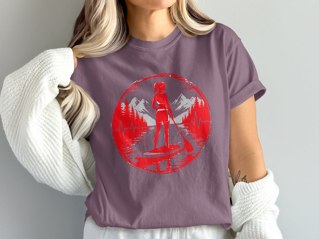 Red circular graphic of a woman paddleboarding with mountains and trees.