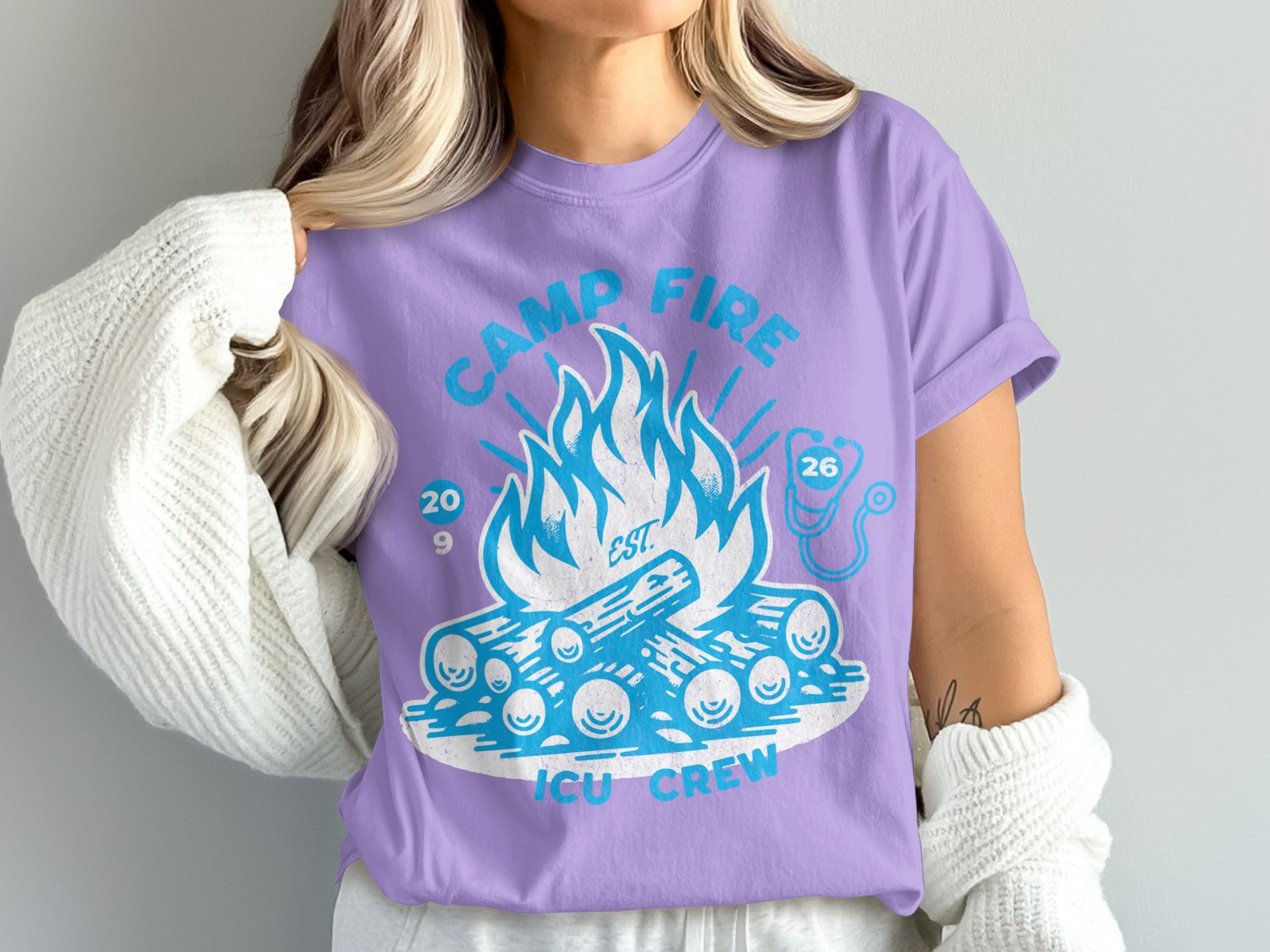 Purple t-shirt with "Camp Fire ICU Crew" text and bonfire graphic.