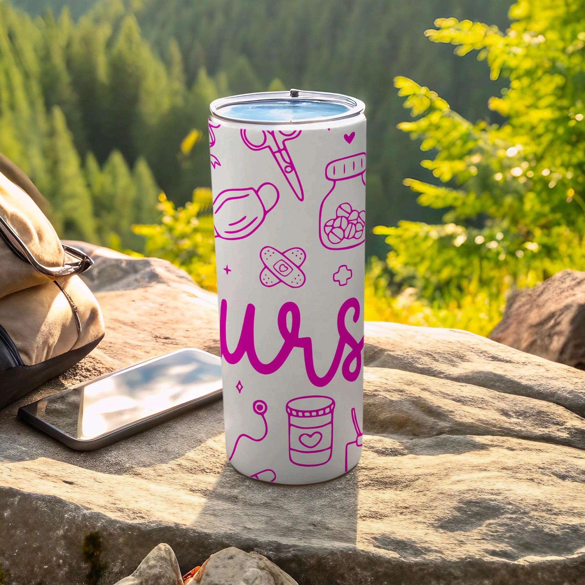 White tumbler with pink medical icons and the word "nurs" in a playful font.