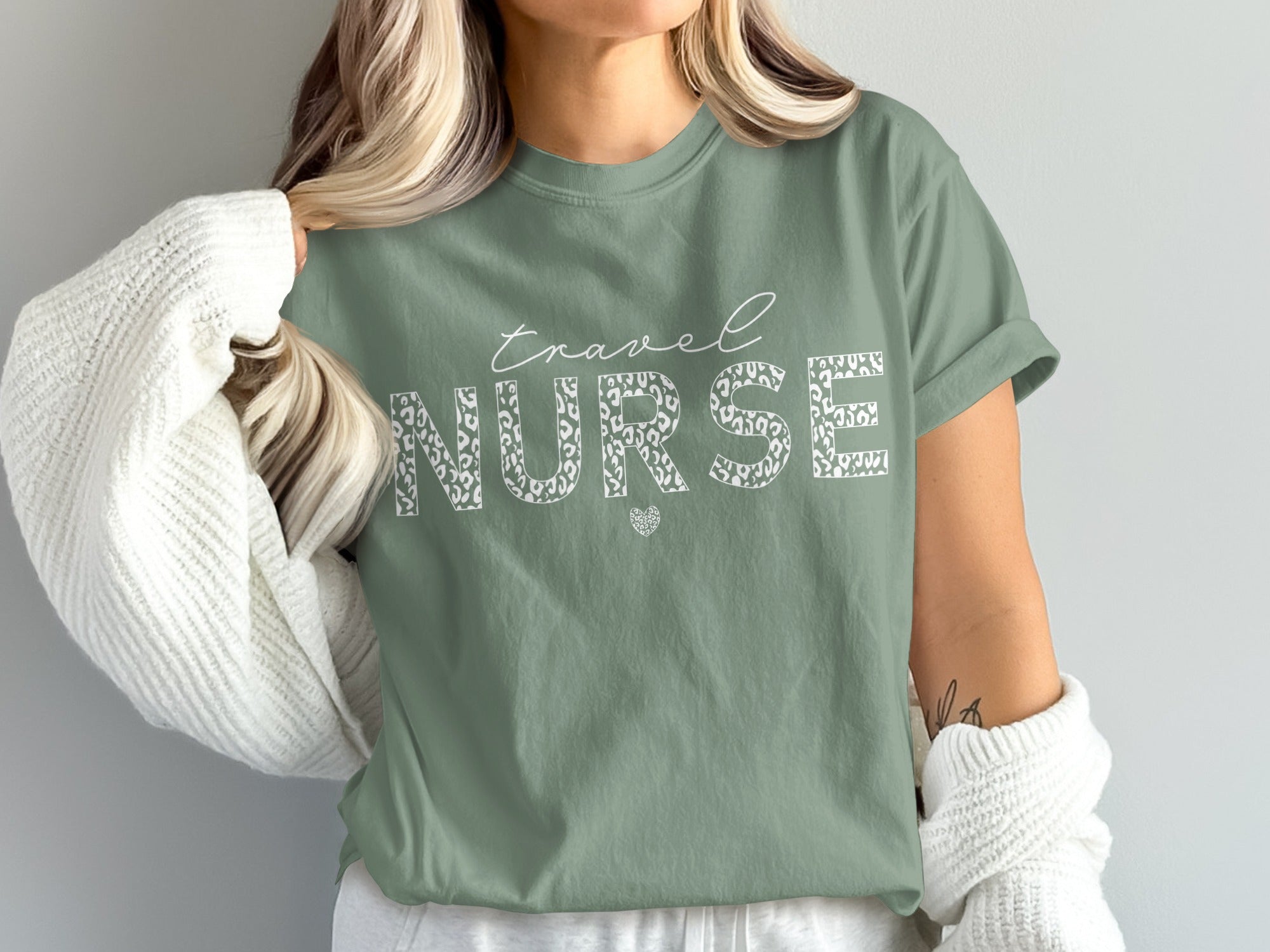 Green t-shirt with "travel NURSE" text in leopard print.