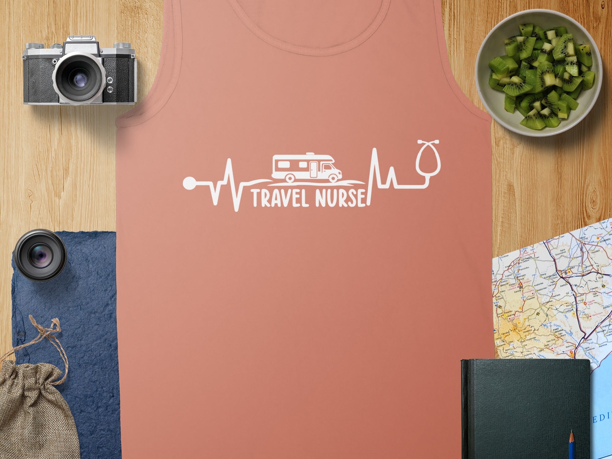 Coral tank top with "Travel Nurse" heartbeat graphic and stethoscope.