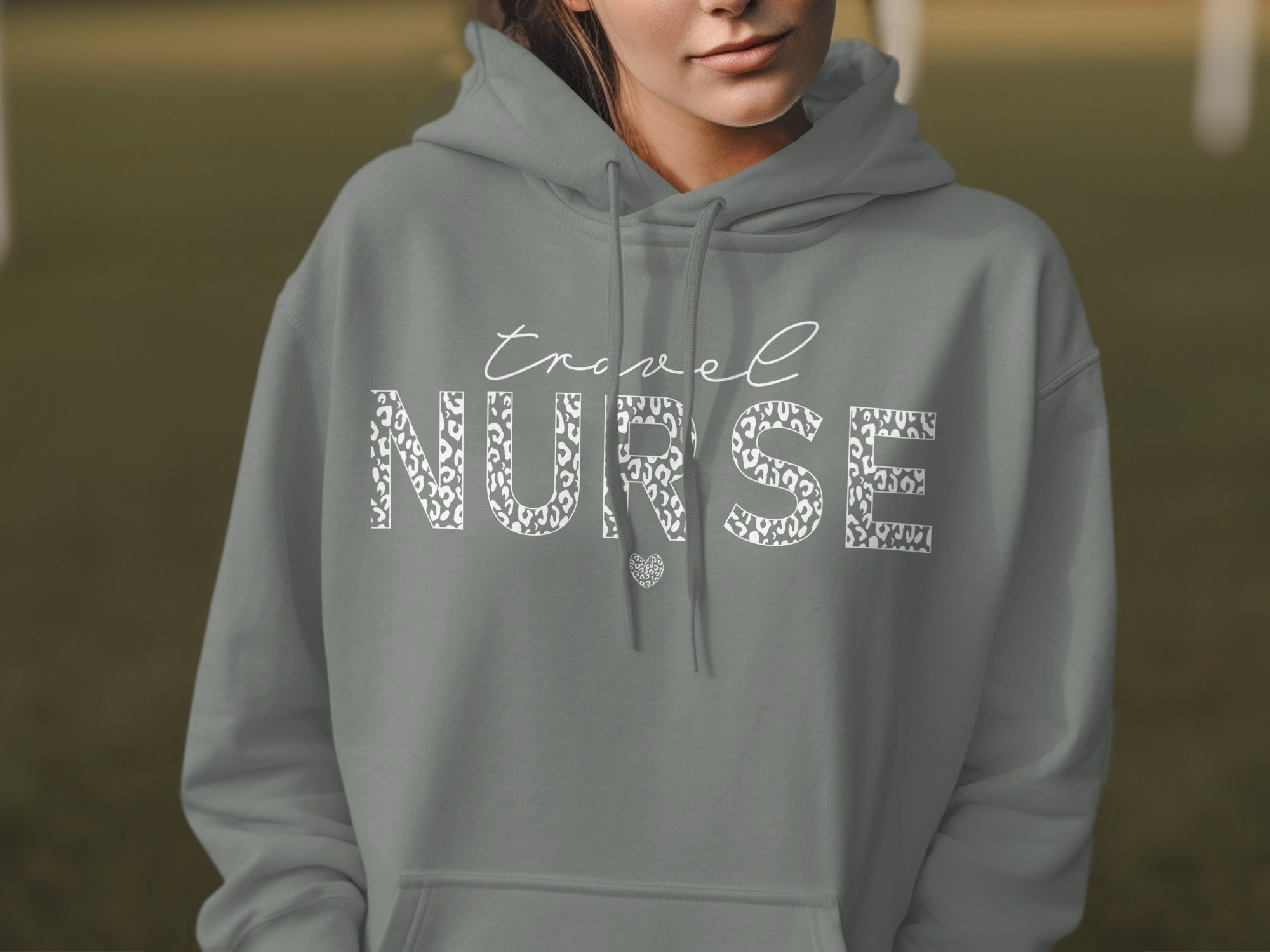 Gray hoodie with "Travel Nurse" text in leopard print and a heart.