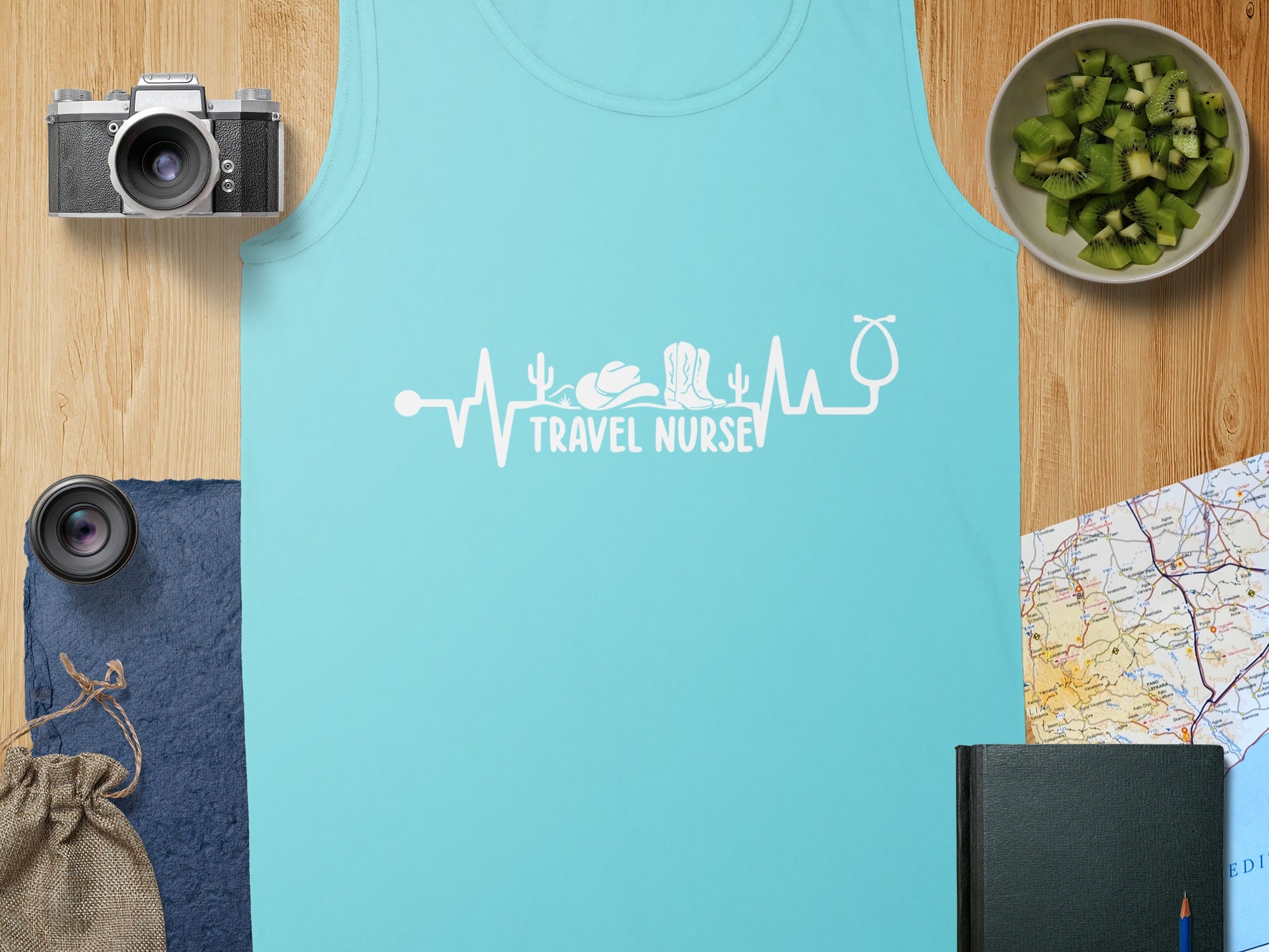 Turquoise tank top with a "travel nurse" stethoscope heartbeat design.