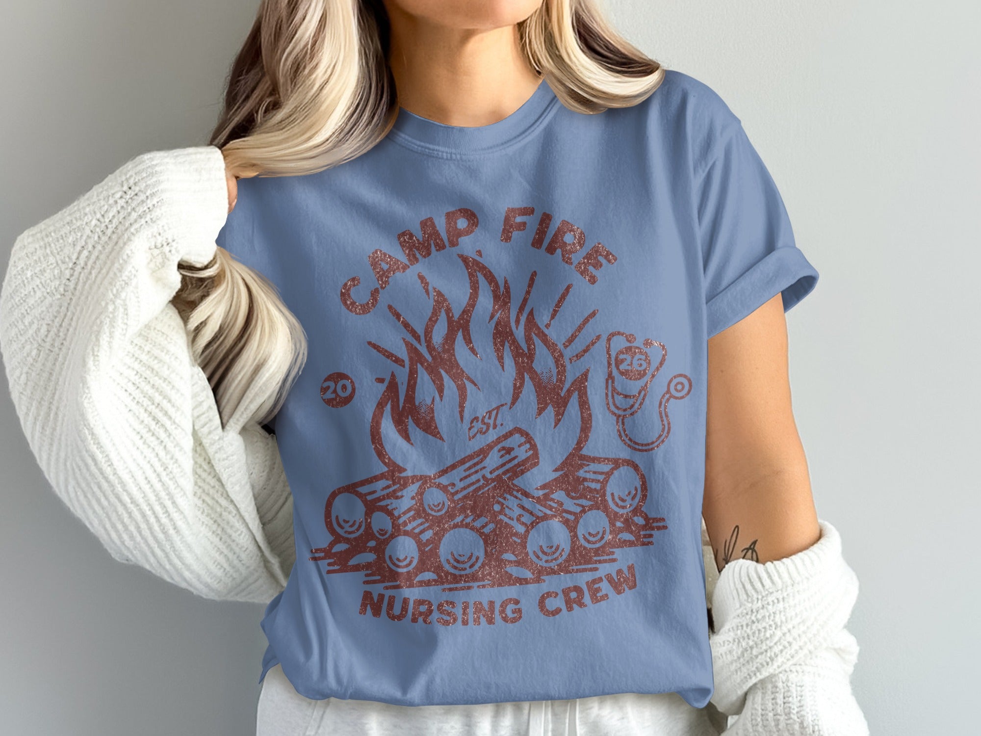 Camp Fire Nursing Crew t-shirt with campfire graphic and stethoscope.