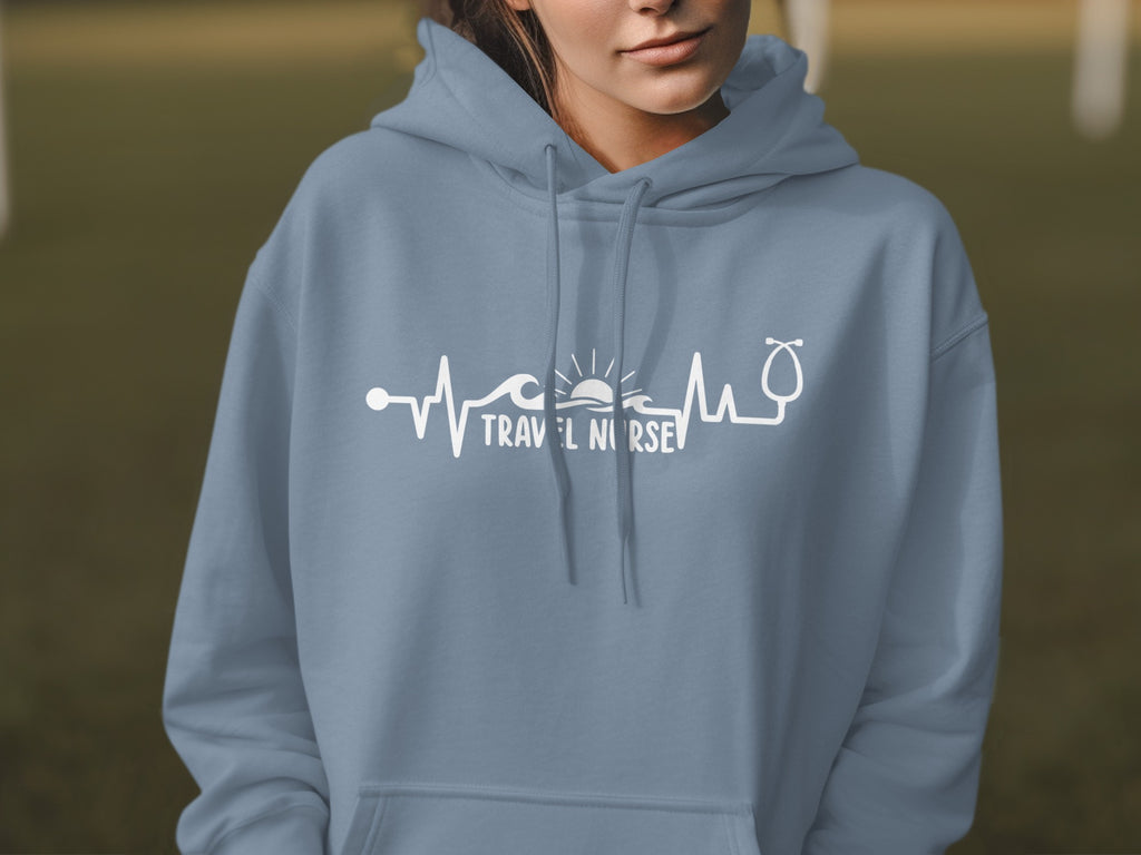 Blue hoodie with a white heartbeat graphic and "Travel Nurse" text.