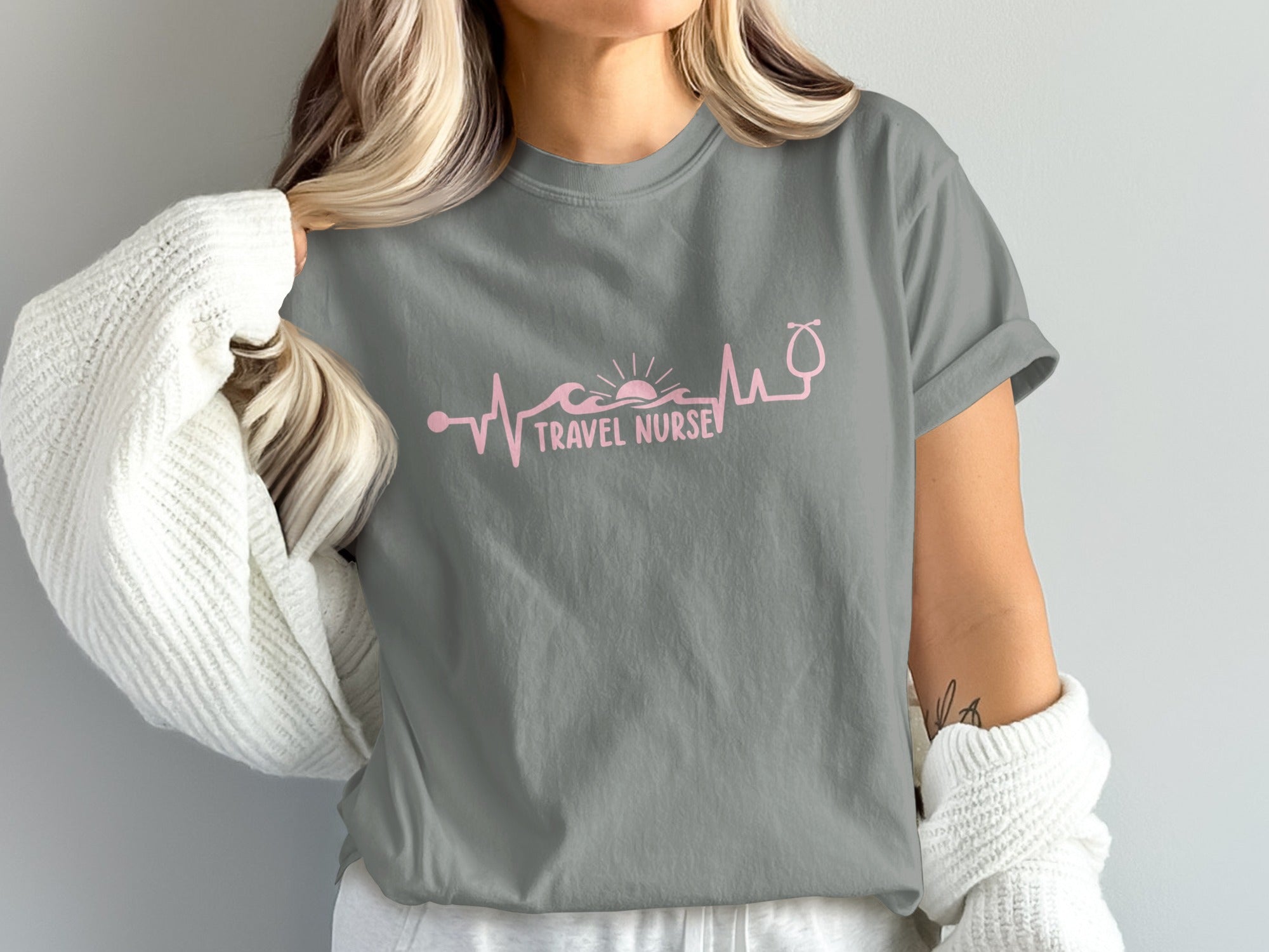Grey t-shirt with pink stethoscope and wave design.