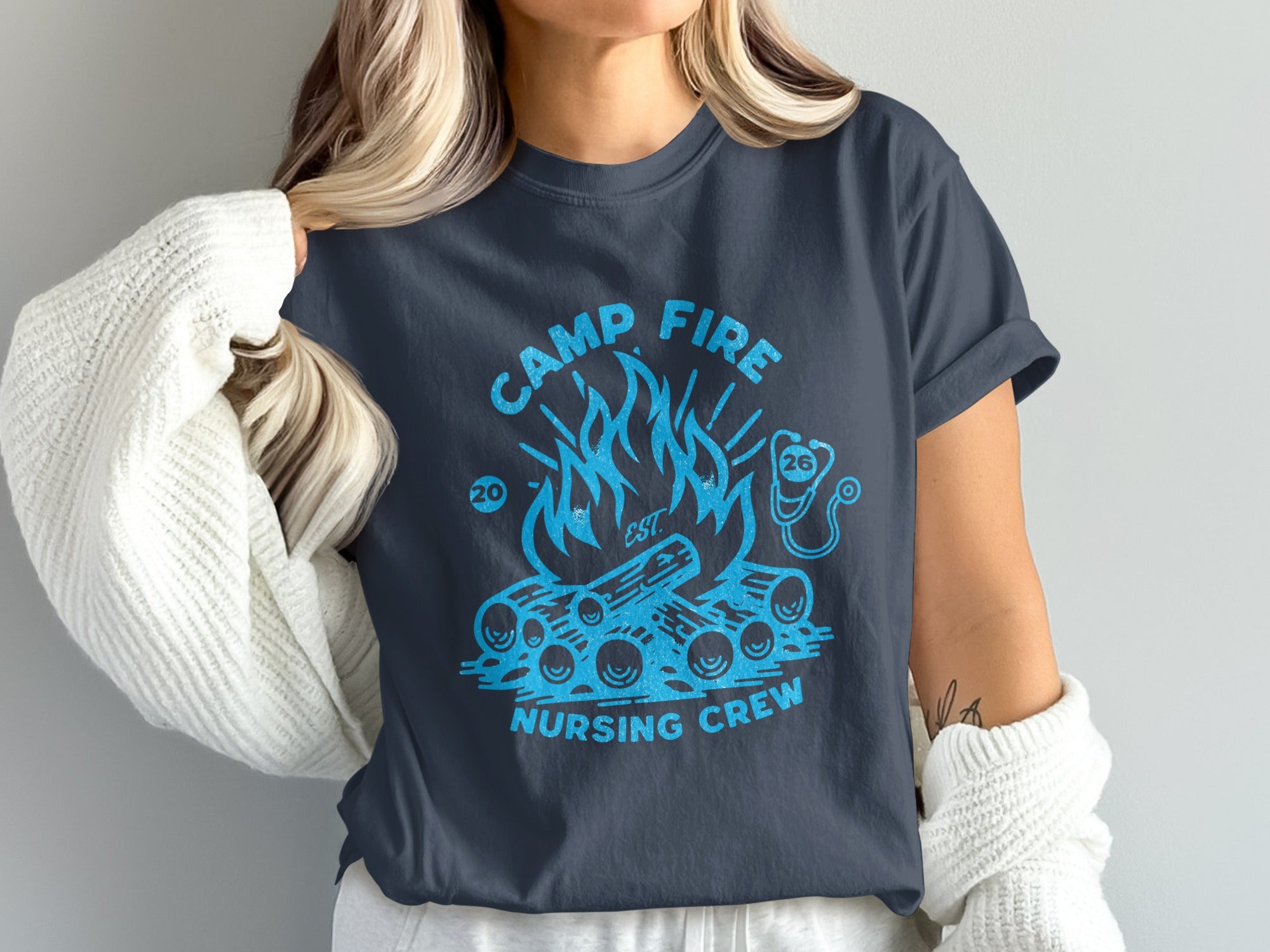 Camp Fire Nursing Crew t-shirt with campfire and stethoscope graphic.