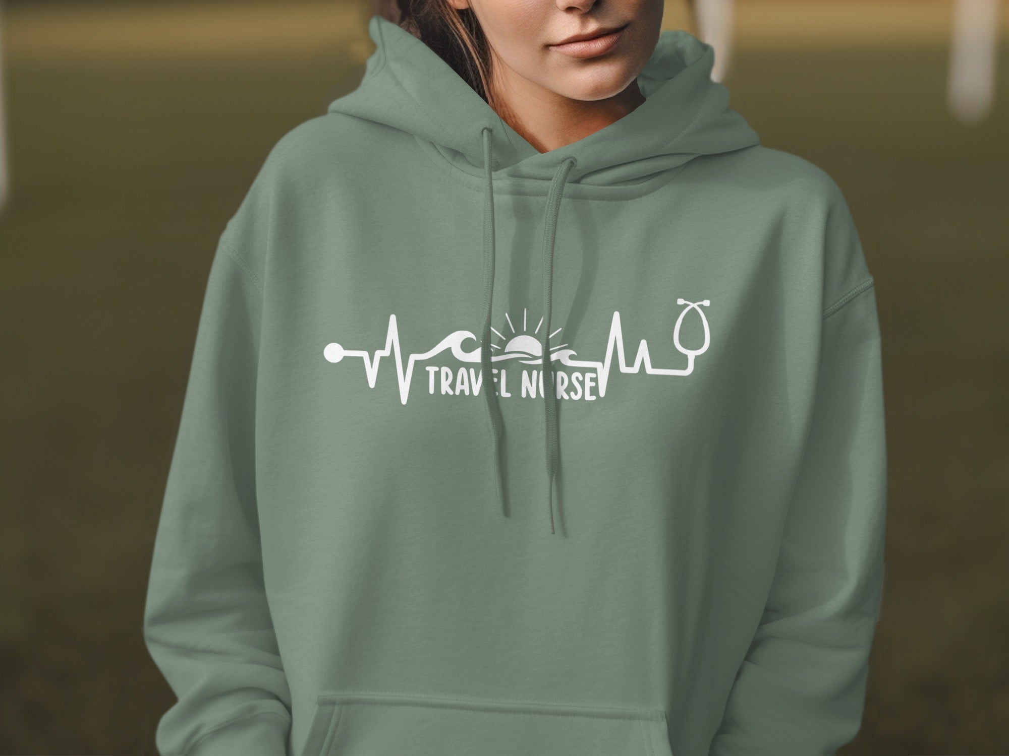 Green hoodie with "Travel Nurse" text and heartbeat graphic.