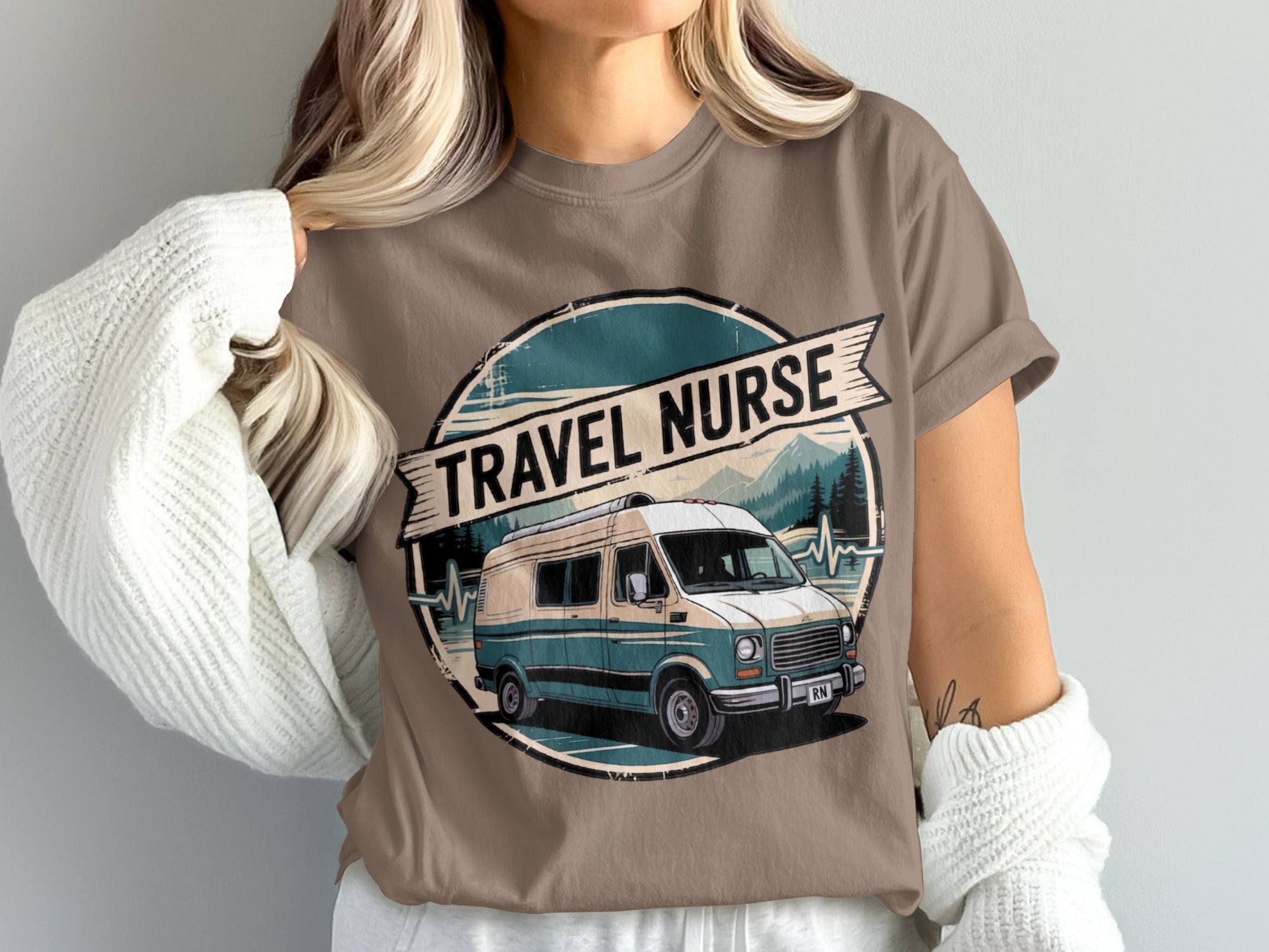 Retro van and mountains graphic on a taupe t-shirt.