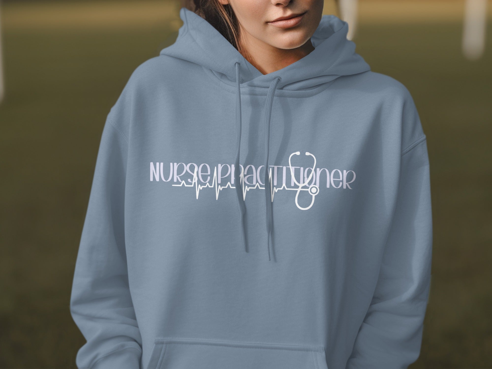 Grey hoodie with "Nurse Practitioner" text and a stethoscope ECG.