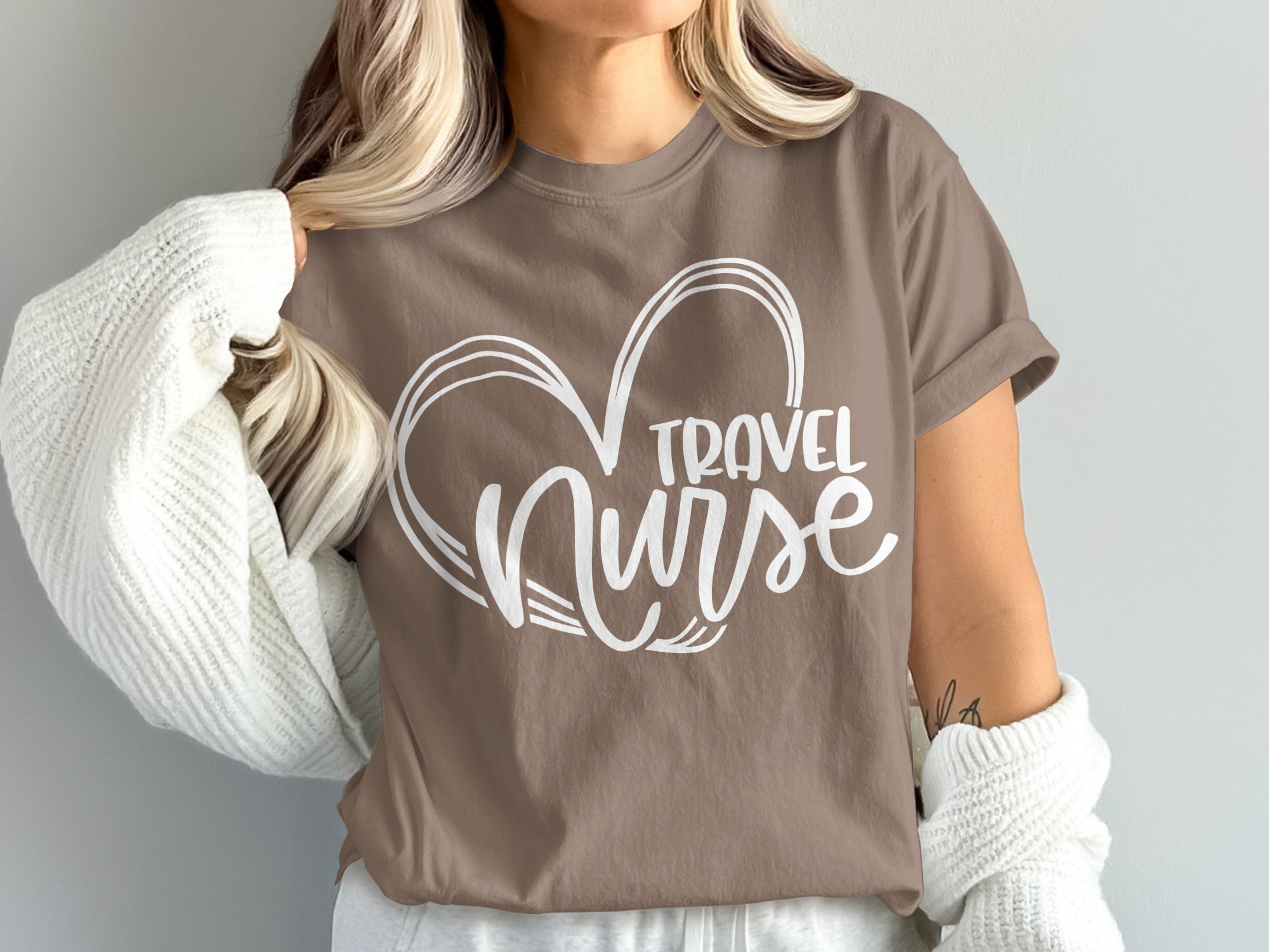 Brown t-shirt with "Travel Nurse" inside a heart outline.