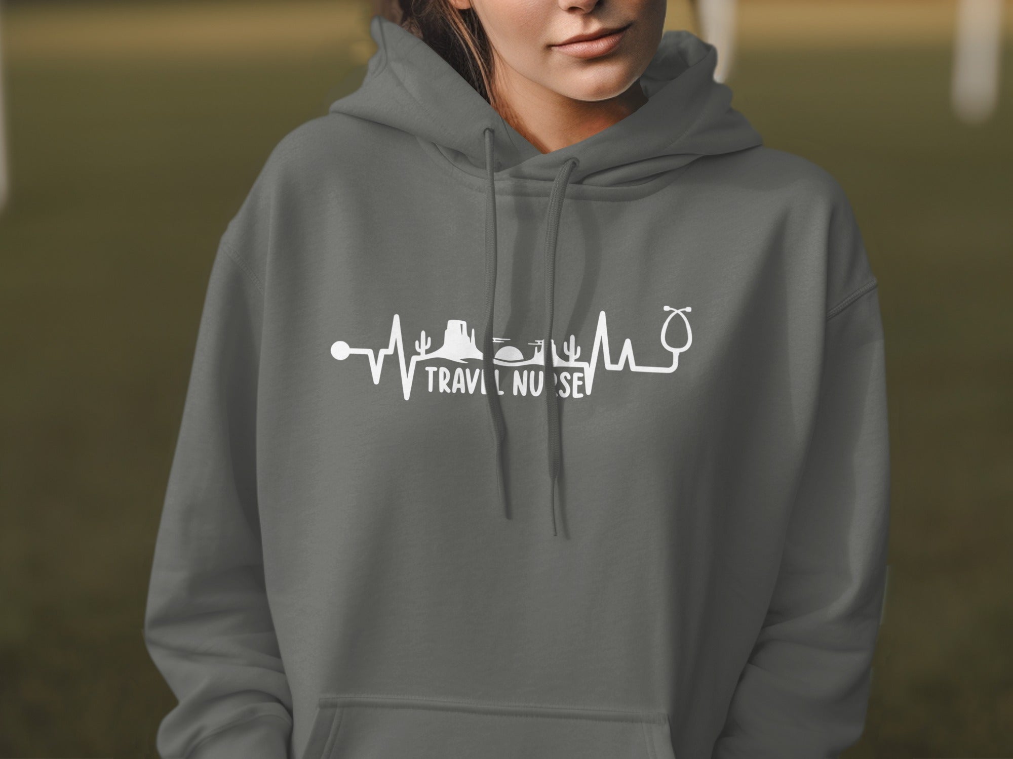 Gray hoodie with "Travel Nurse" text and medical/desert graphic.