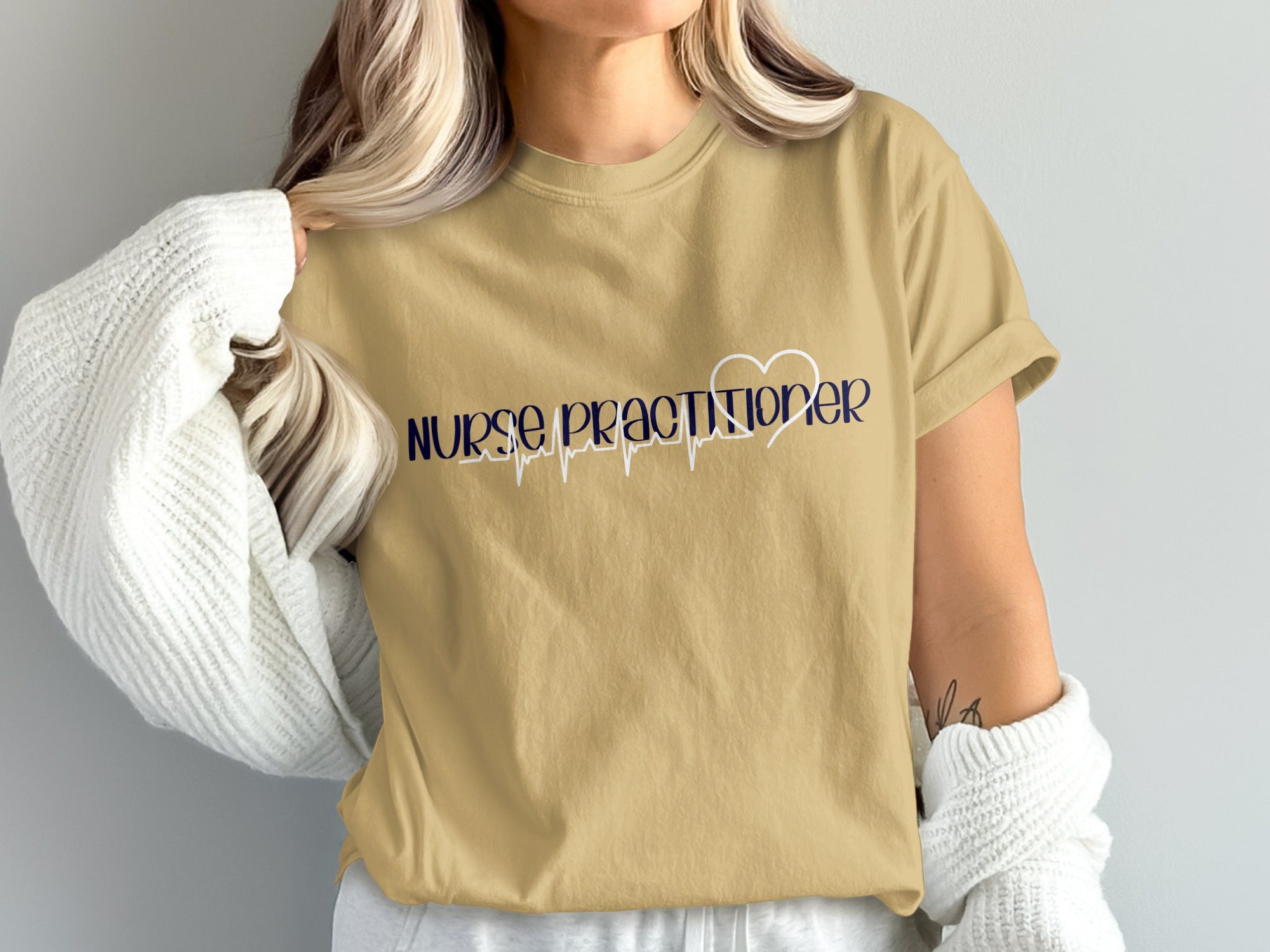 Tan t-shirt with "Nurse Practitioner" text and heart rate graphic.