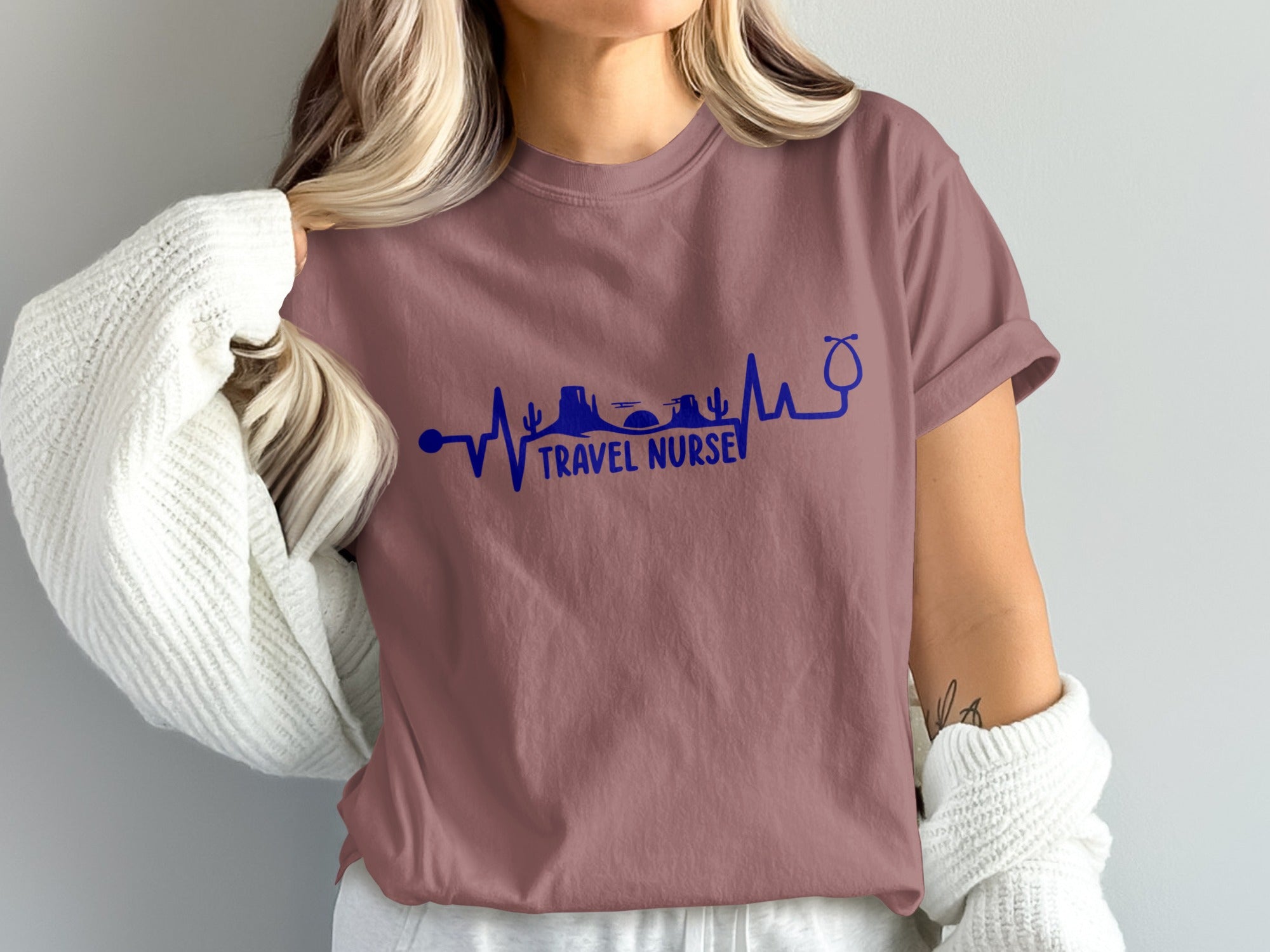 T-shirt with "Travel Nurse" text and stethoscope heartbeat graphic.