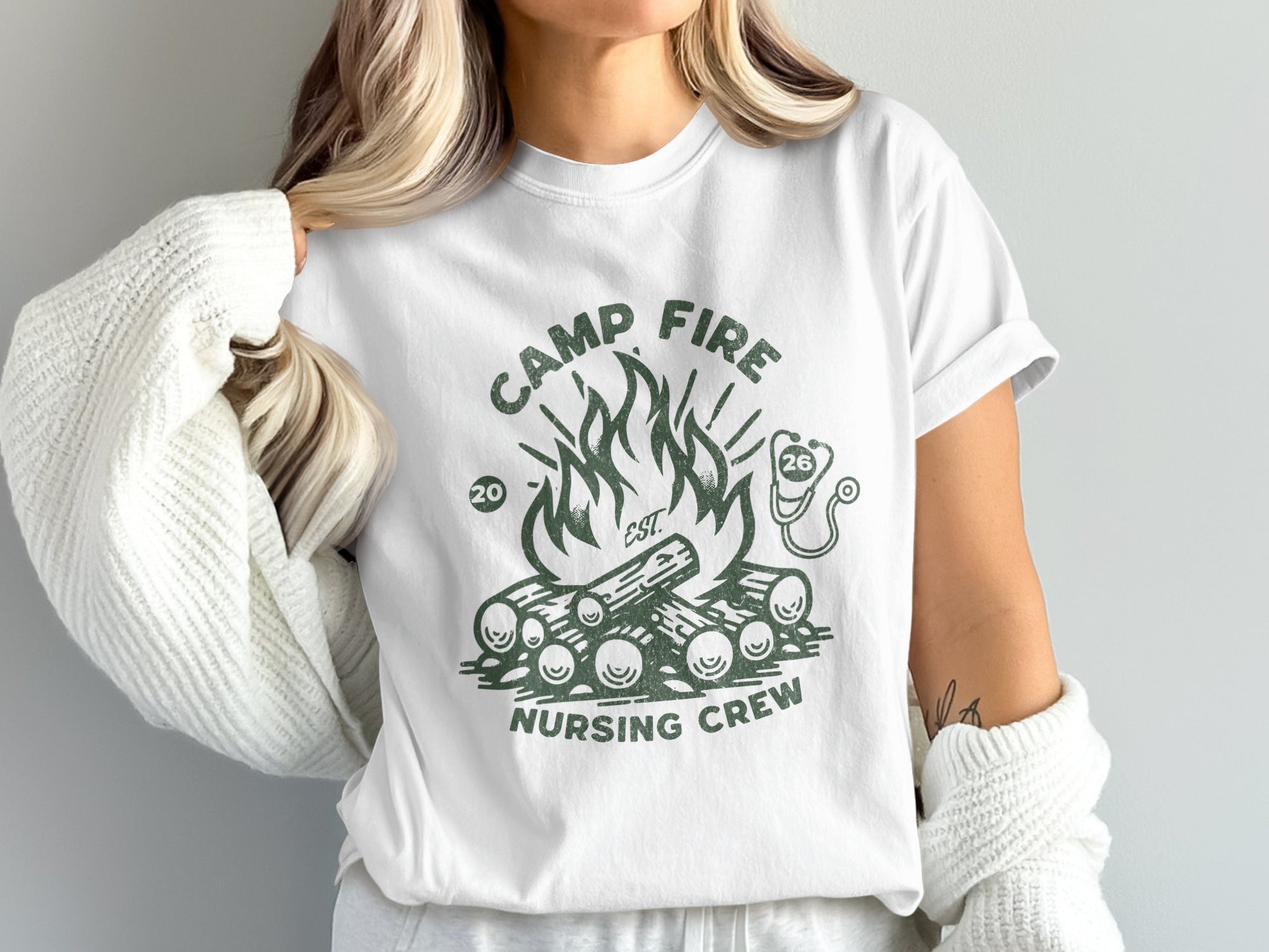 White t-shirt with "Camp Fire Nursing Crew" and campfire graphic.