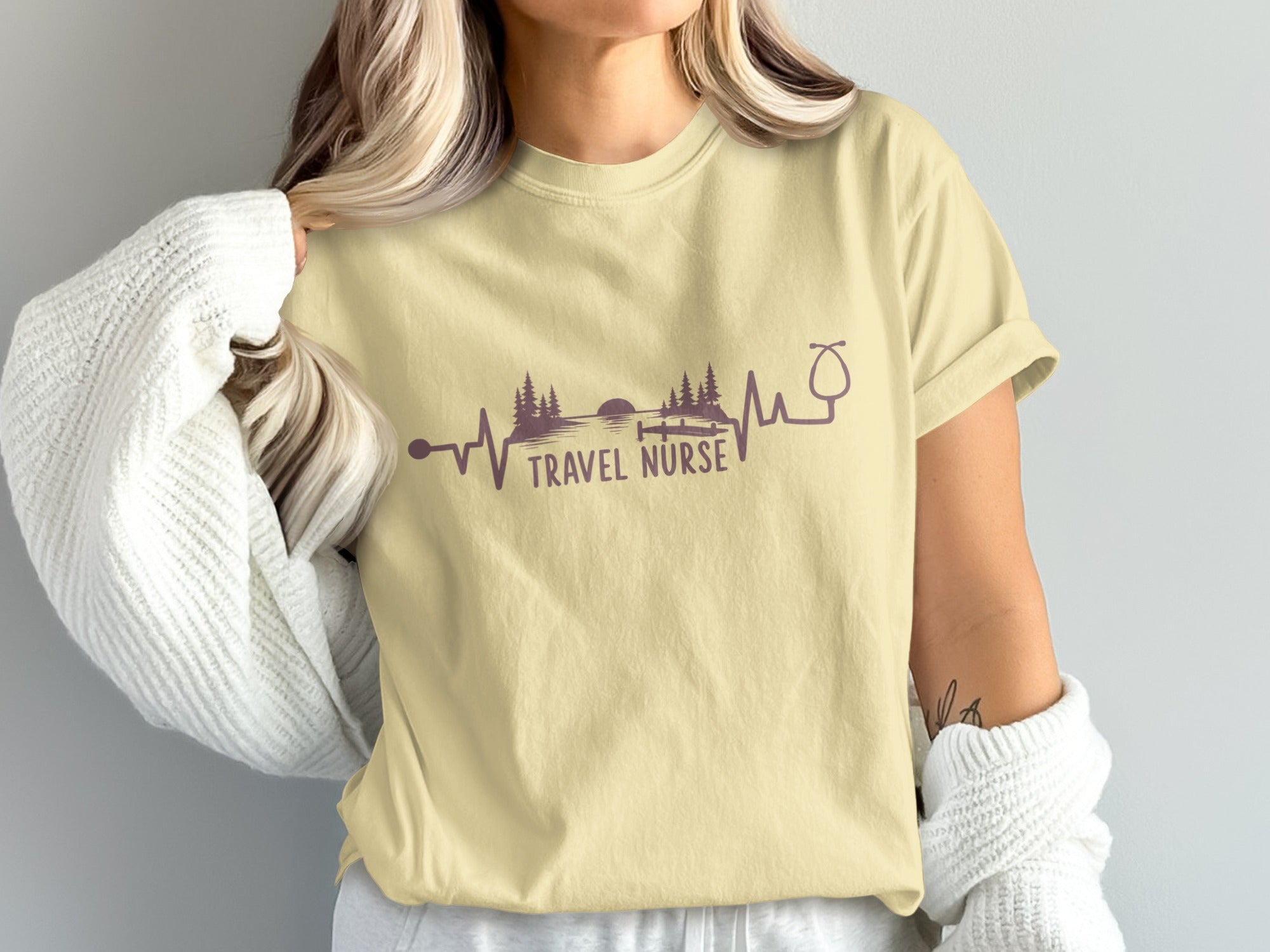 Cream t-shirt with "TRAVEL NURSE" text and a heartbeat/stethoscope design.