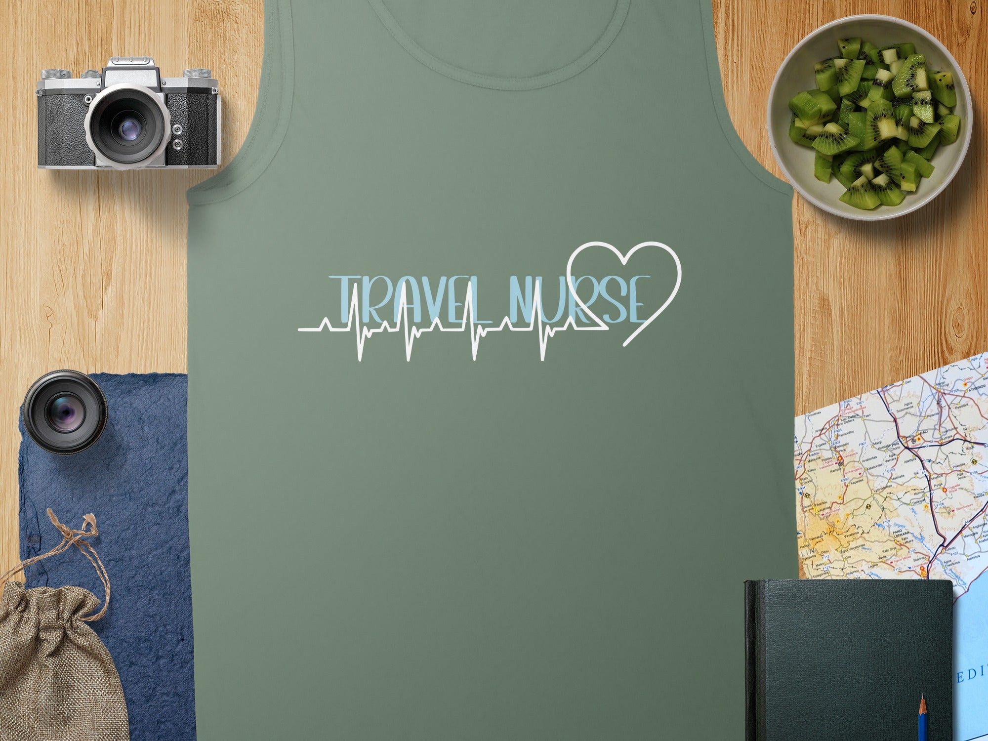 Light green tank top with "Travel Nurse" and a heart-shaped EKG design.