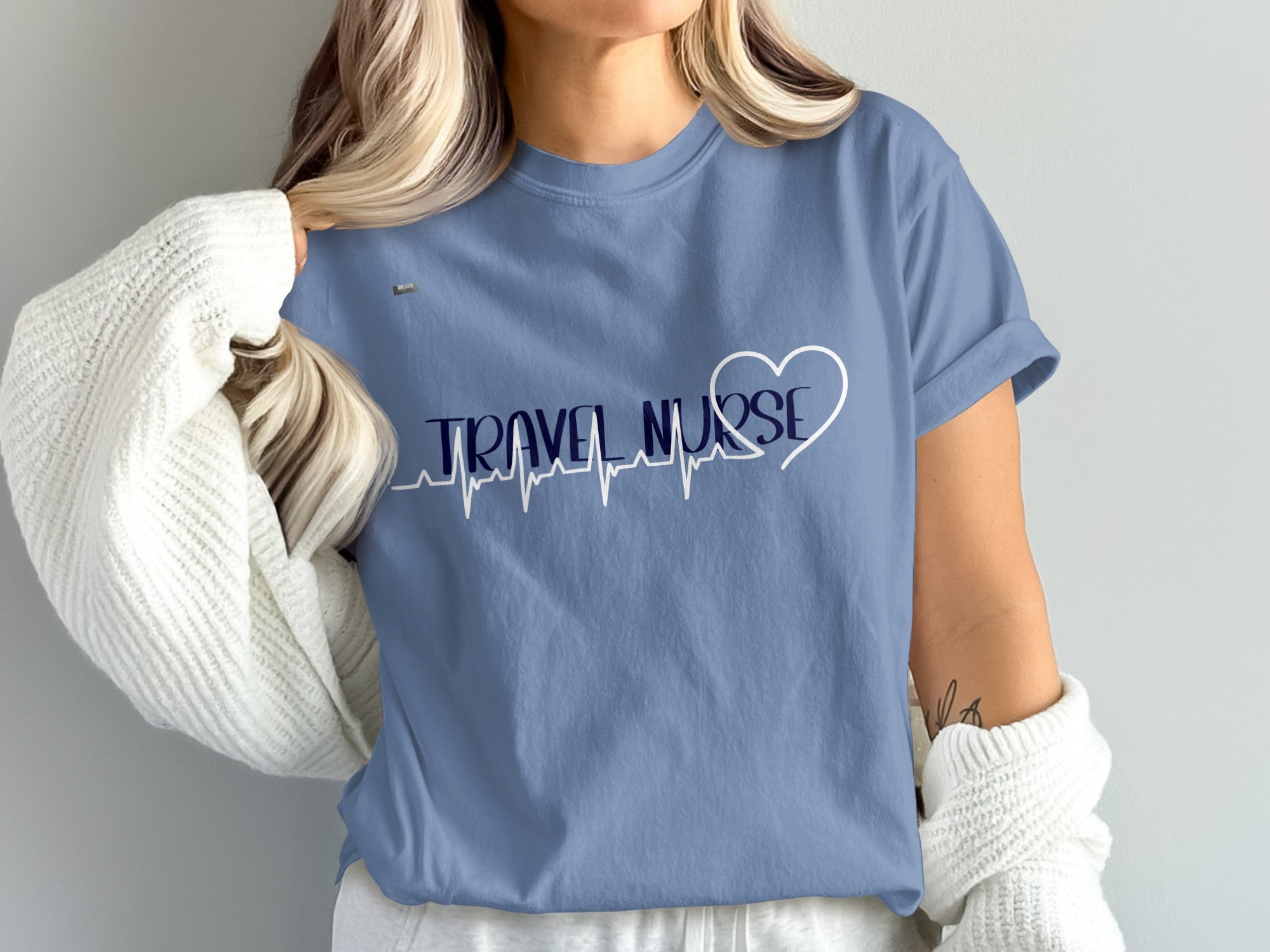 Blue t-shirt with "TRAVEL NURSE" and a heart-shaped EKG line.