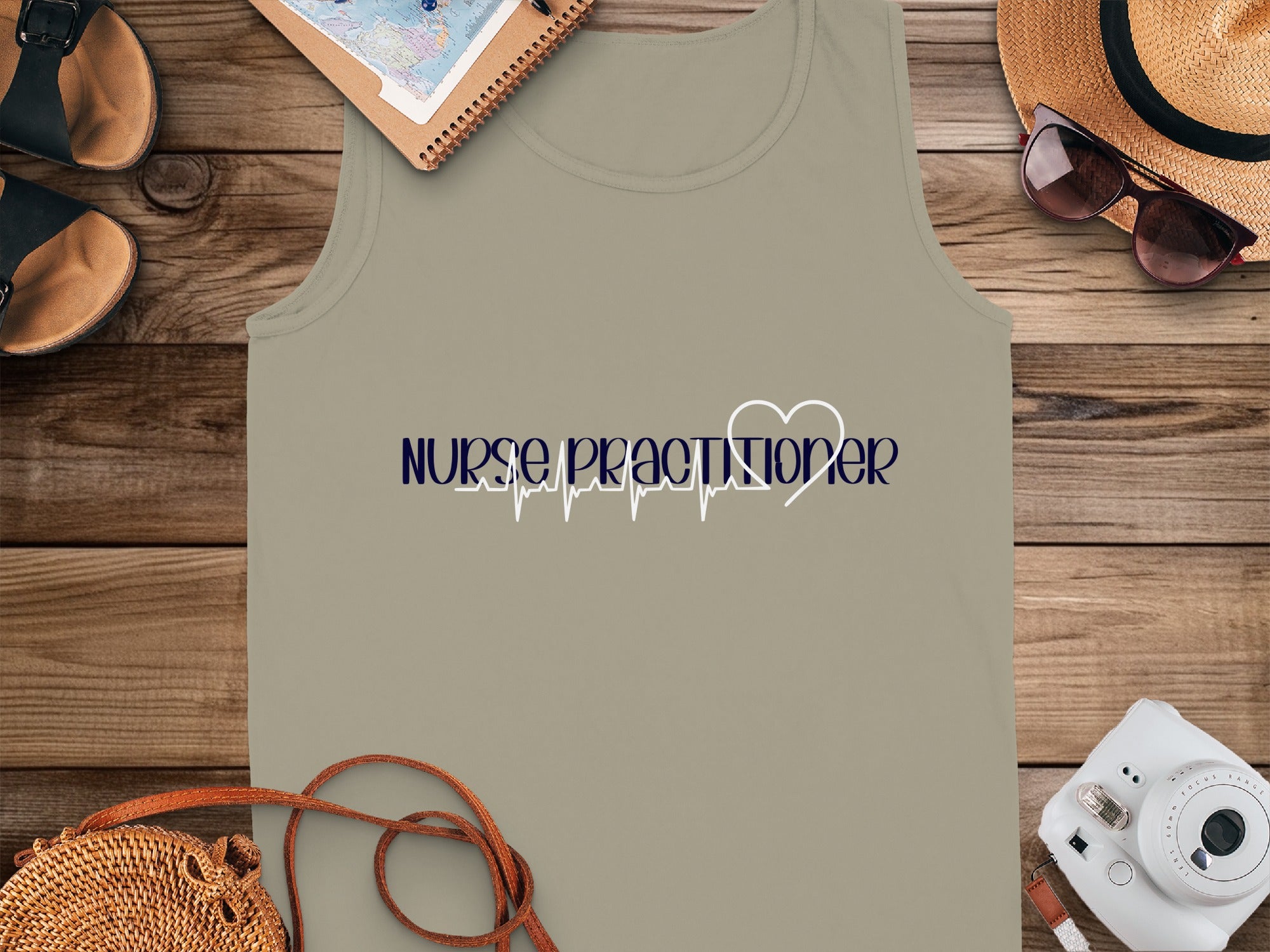 Nurse Practitioner text with a heartbeat line on a tank top.