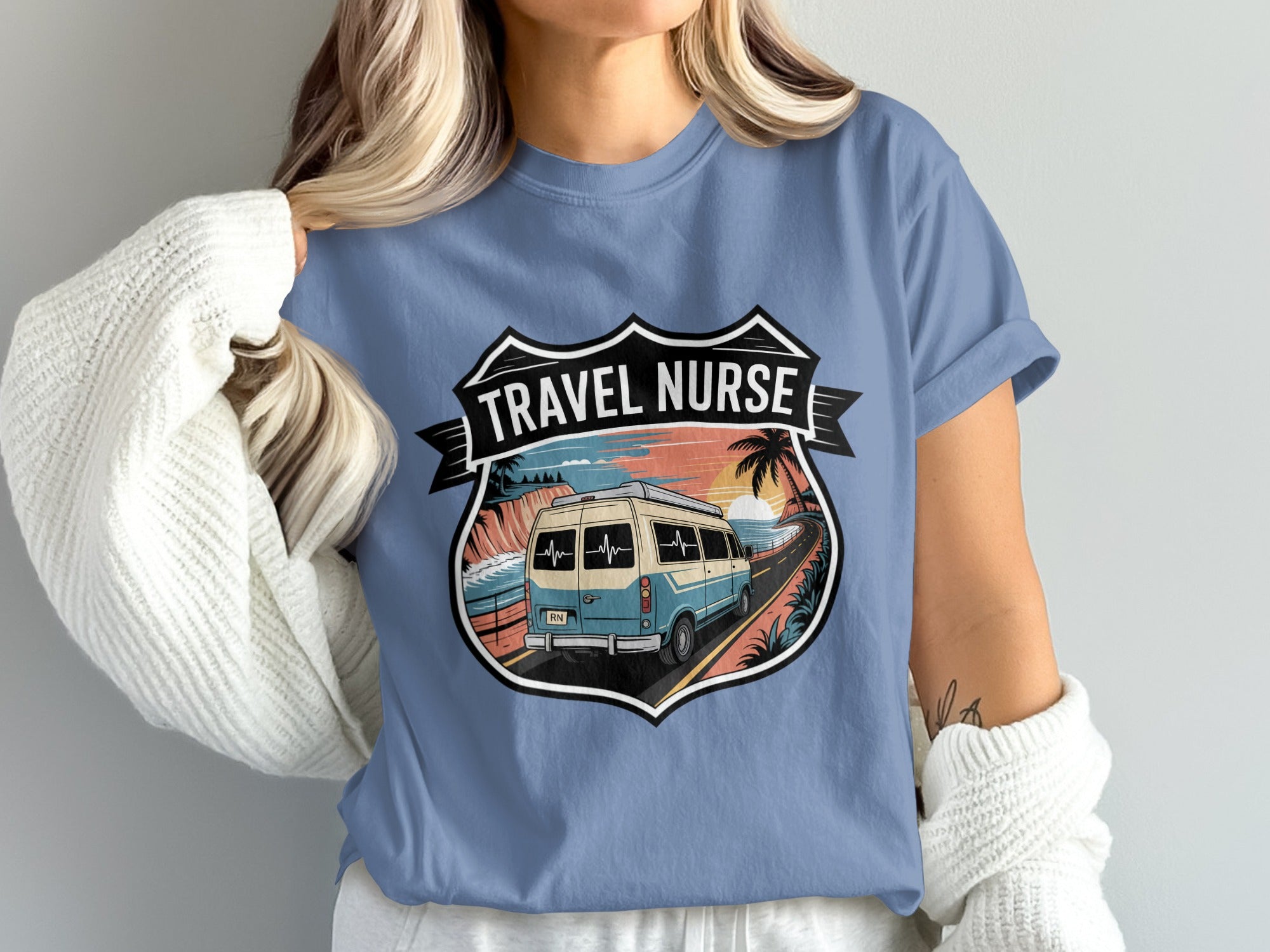 T-shirt graphic of a van on a coastal road with "TRAVEL NURSE" text.