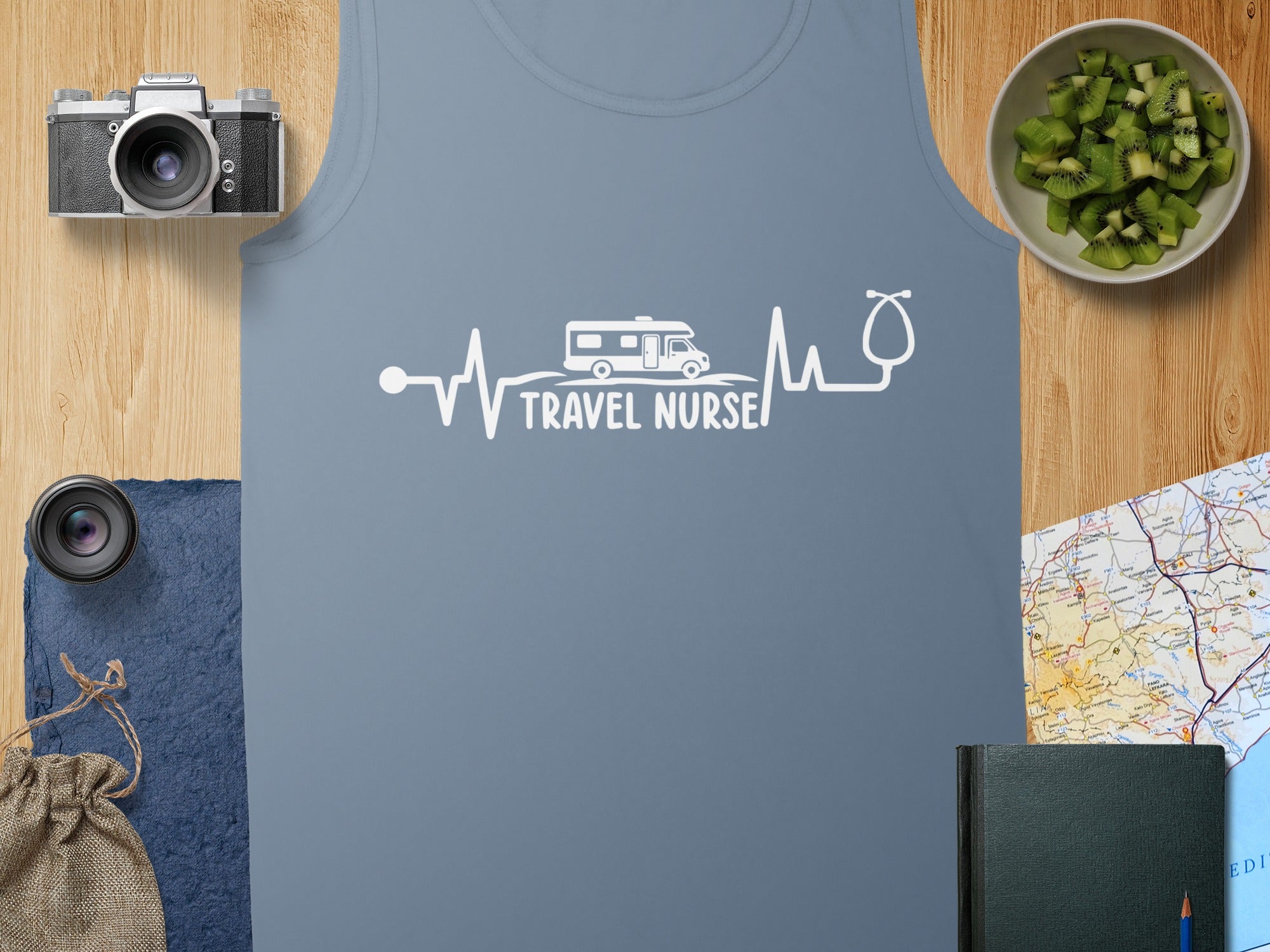 Blue tank top with a white electrocardiogram line featuring a camper and "TRAVEL NURSE" text.