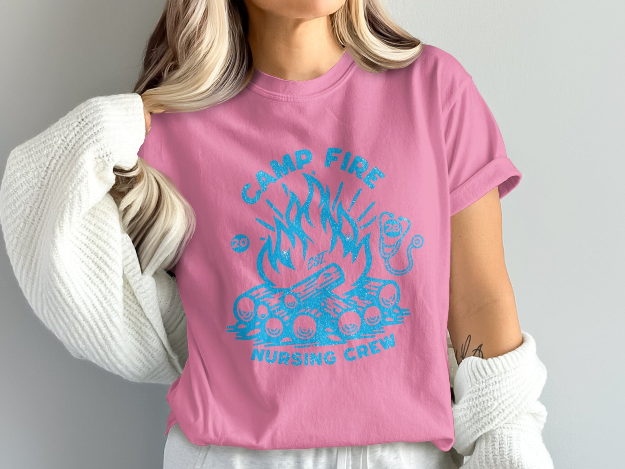 Pink t-shirt with "Camp Fire Nursing Crew" text and campfire graphic.