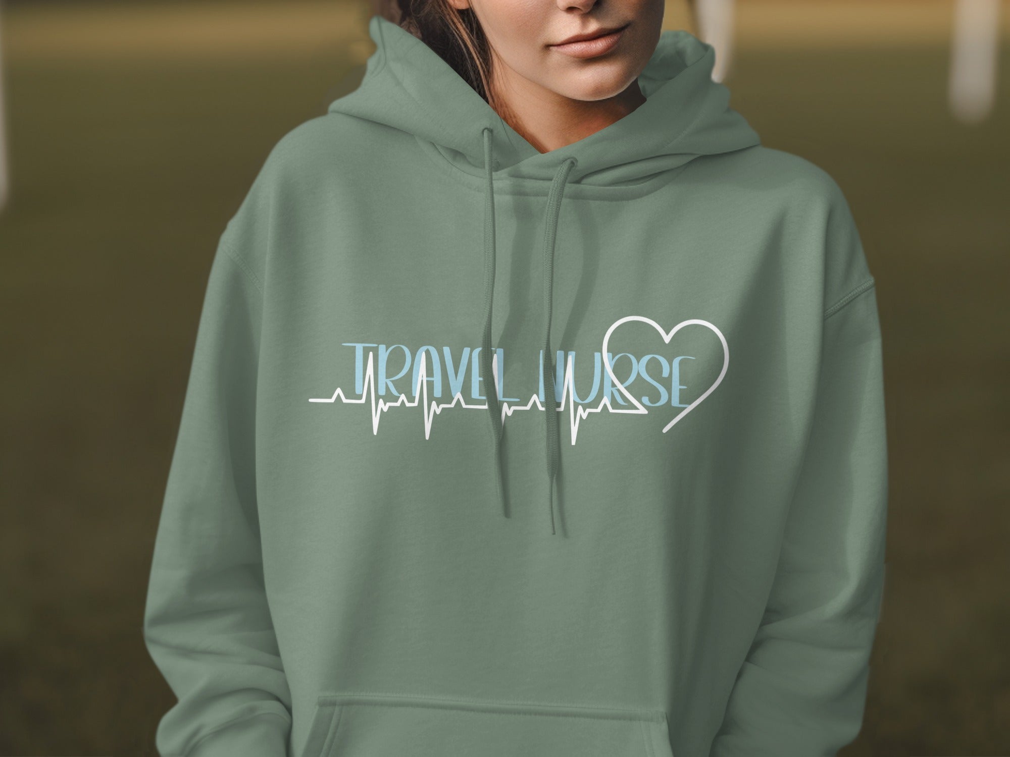 Green hoodie with "TRAVEL NURSE" and heart graphic.