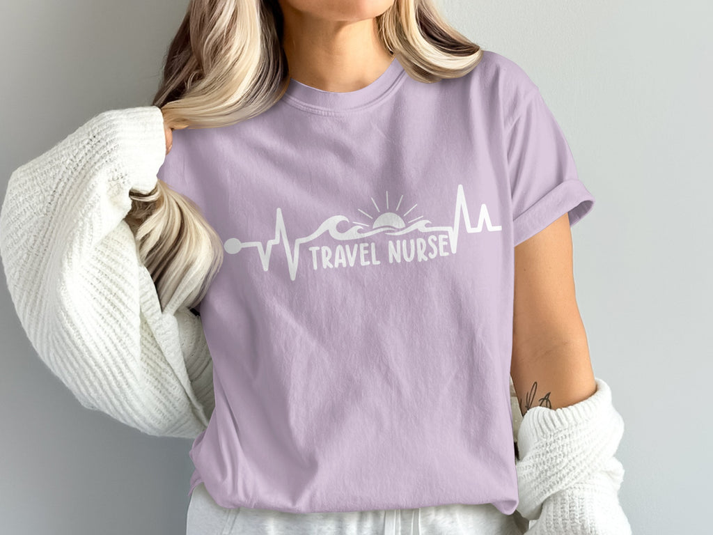 Purple t-shirt with "Travel Nurse" heartbeat and sun graphic.