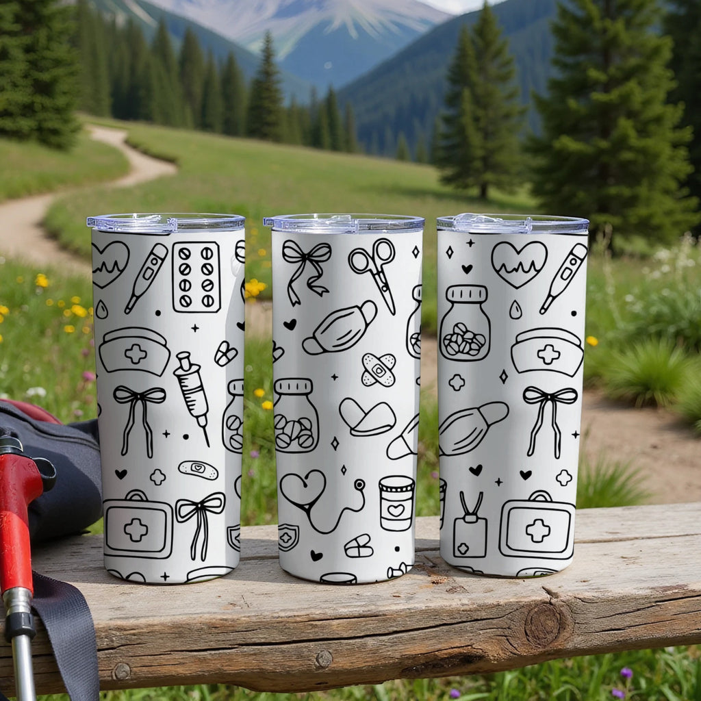 Three white tumblers with medical icons on a wooden surface.