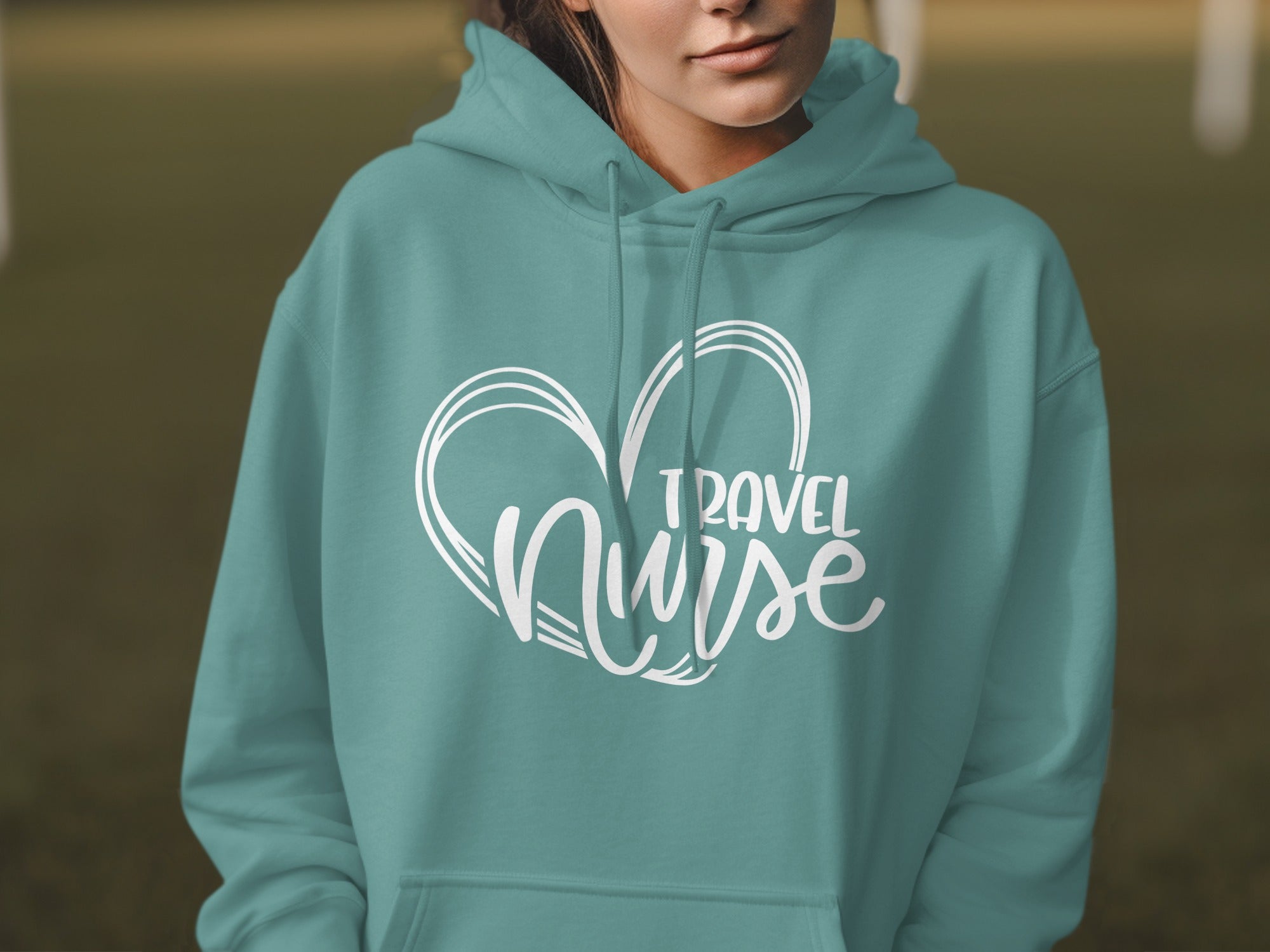 Teal hoodie with "Travel Nurse" text and heart graphic.
