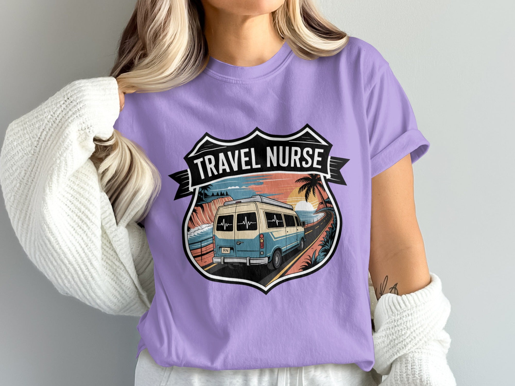 Van driving on coastal road under sunset within shield-shaped graphic.