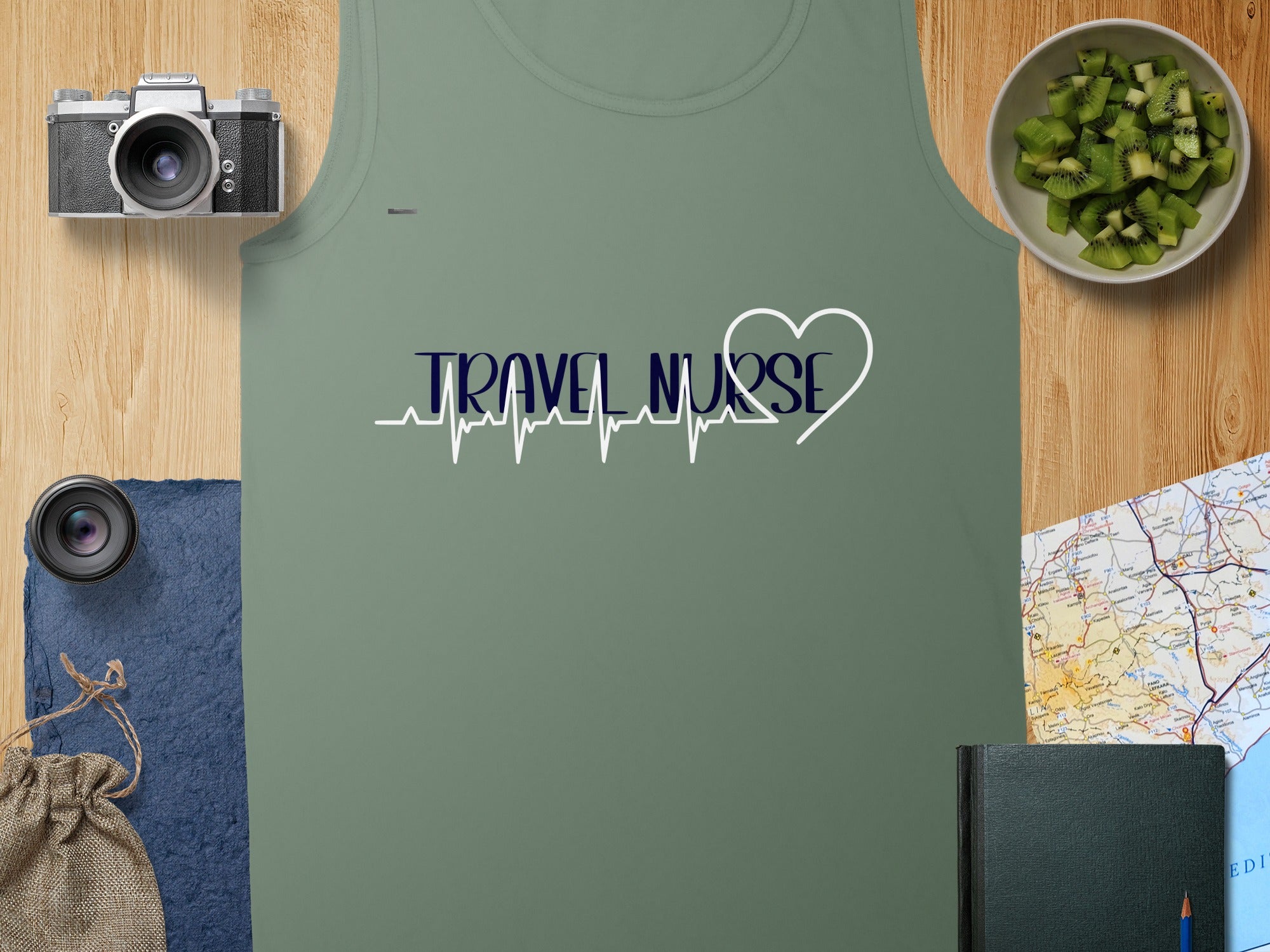 Olive green tank top with "TRAVEL NURSE" and a heartbeat pulse design.