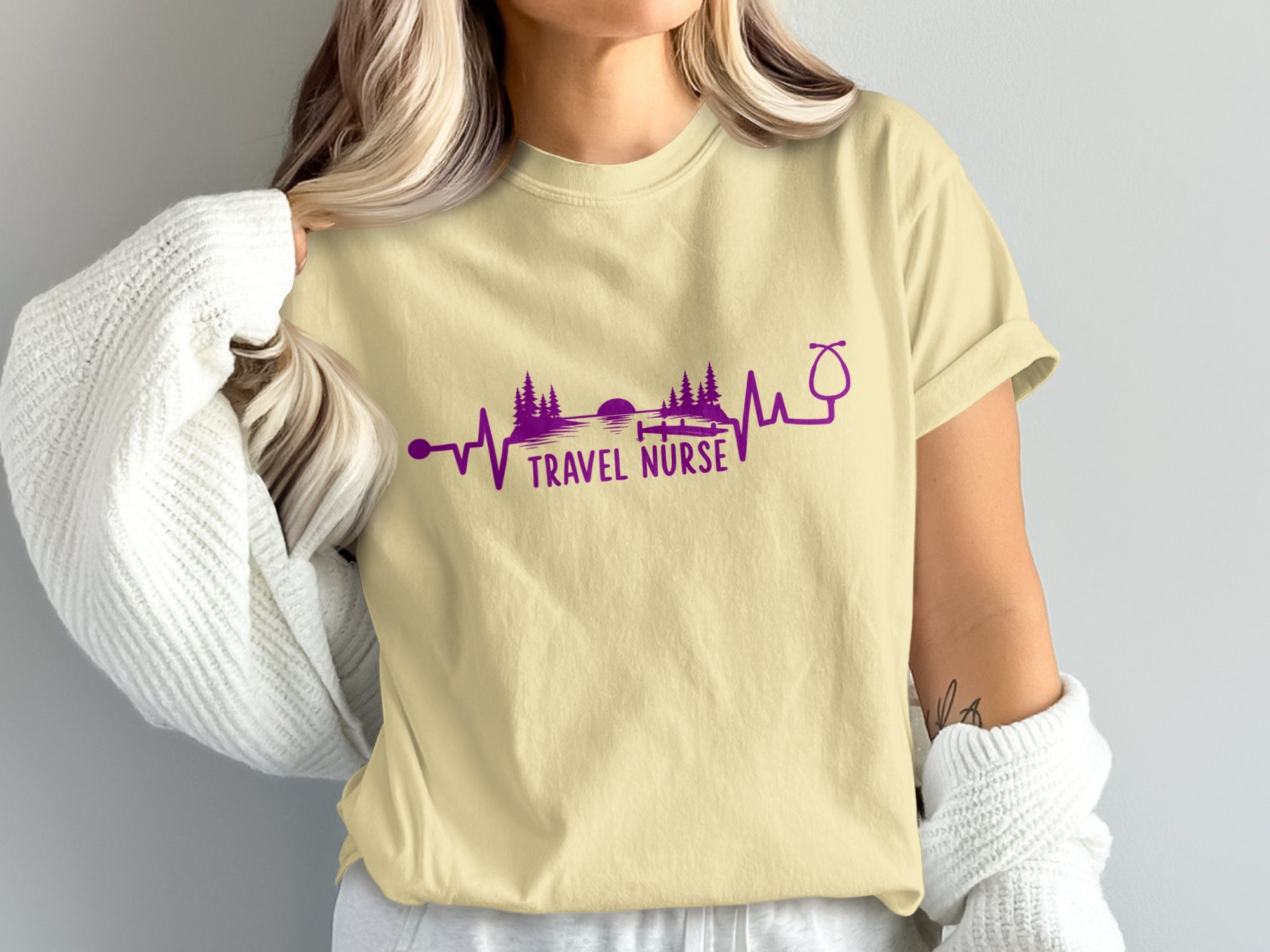 Light yellow t-shirt with purple travel nurse heartbeat graphic and text.