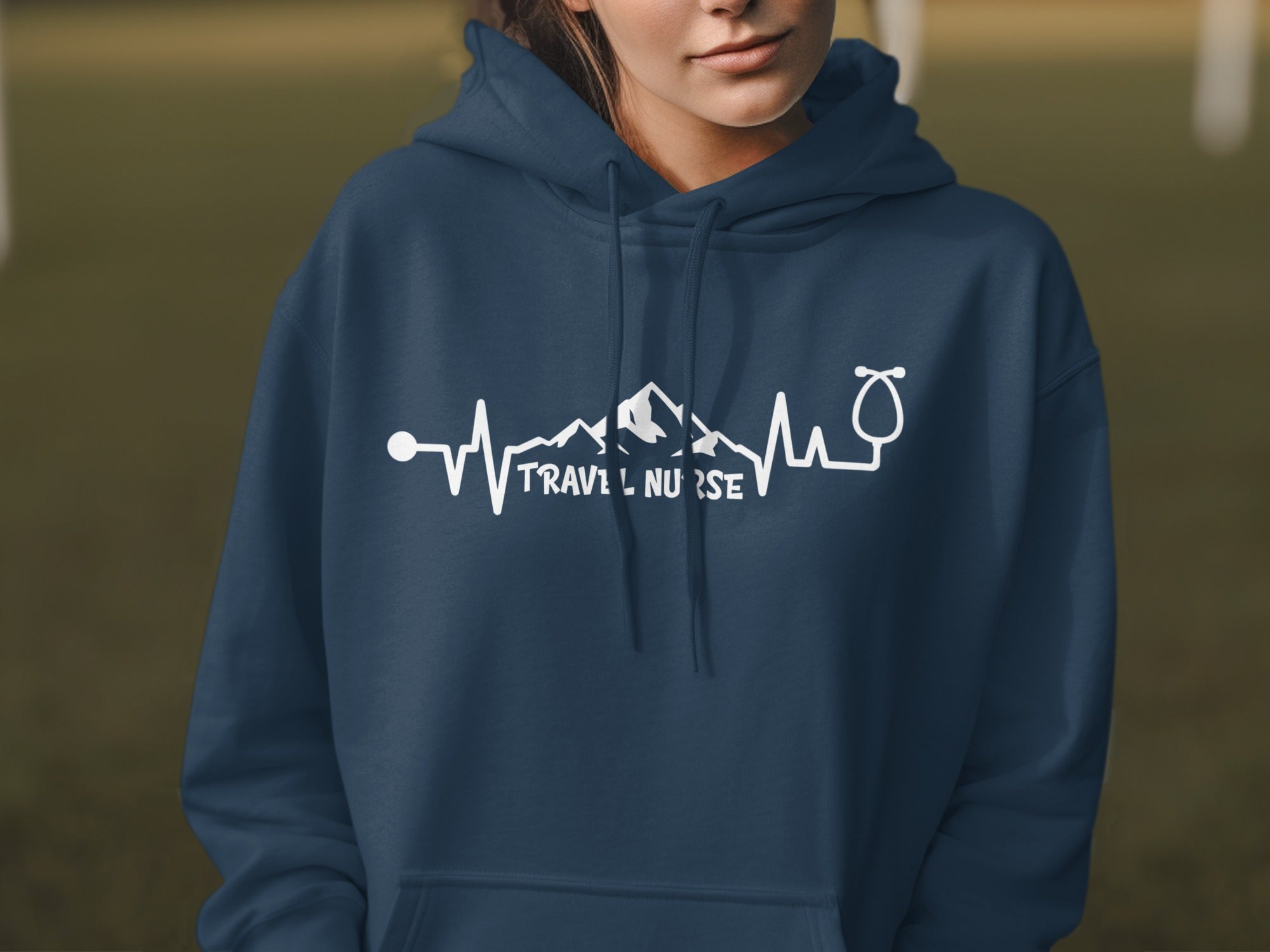 Navy hoodie with "Travel Nurse" text and mountain heartbeat design.