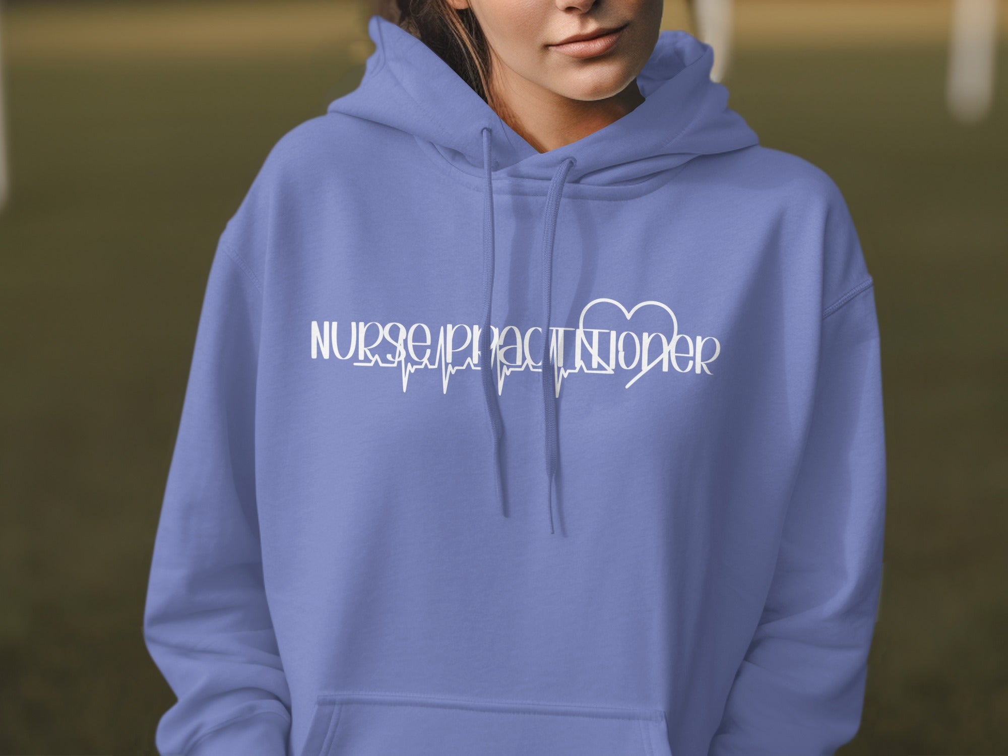 Periwinkle hoodie with "Nurse Practitioner" text and heart monitor graphic.