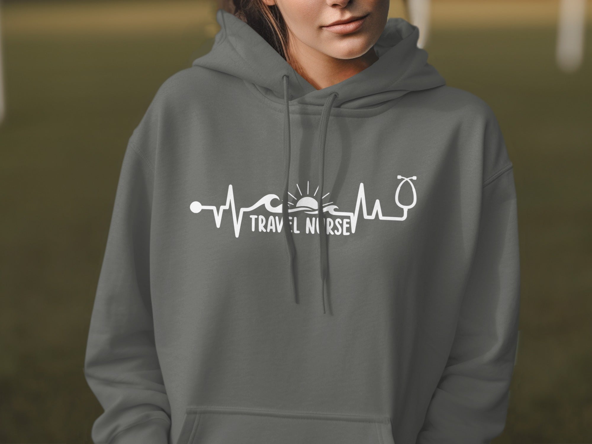 Grey hoodie with "Travel Nurse" text and heartbeat wave graphic.